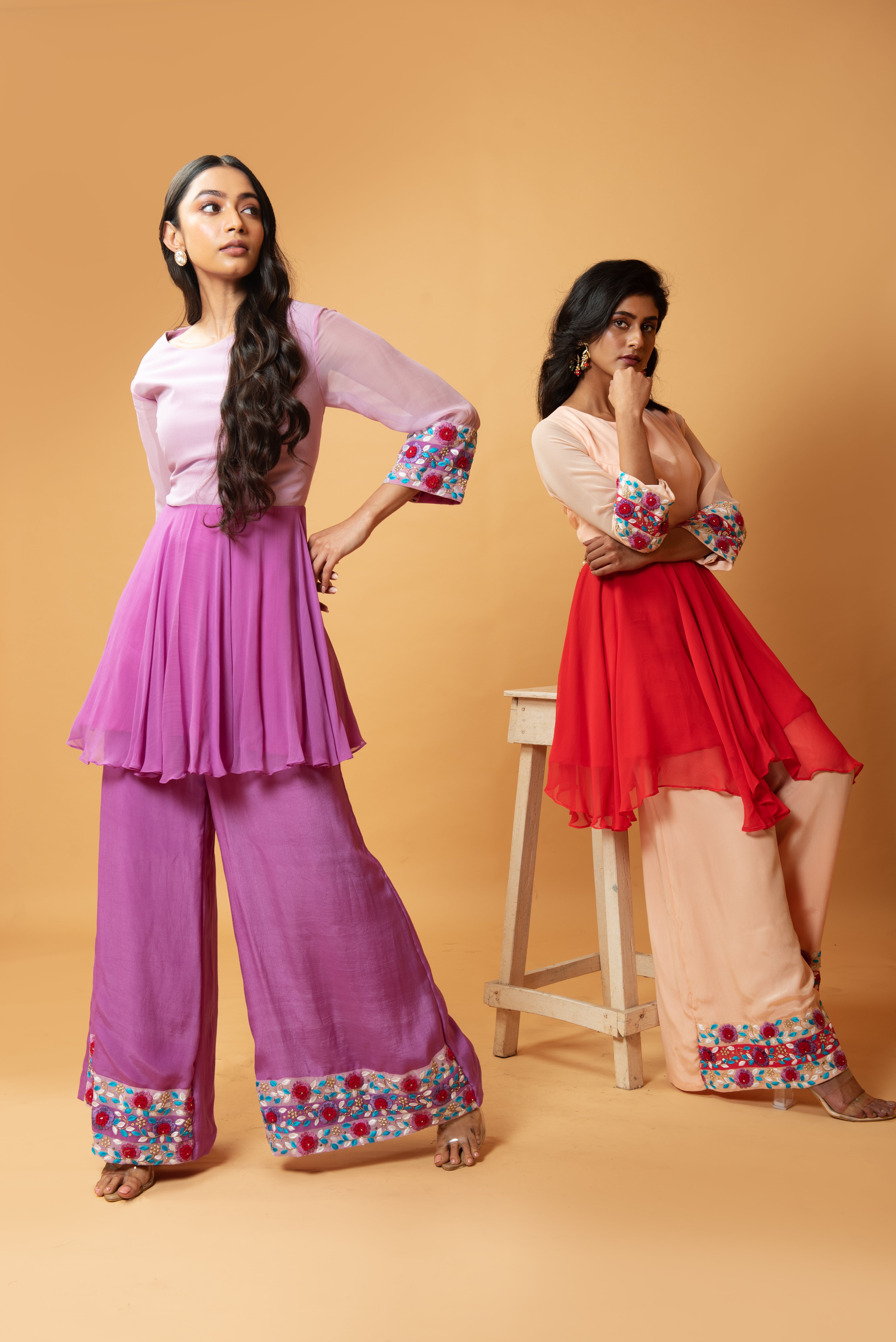 Red double-shaded sharara set with intricate floral hand embroidery.