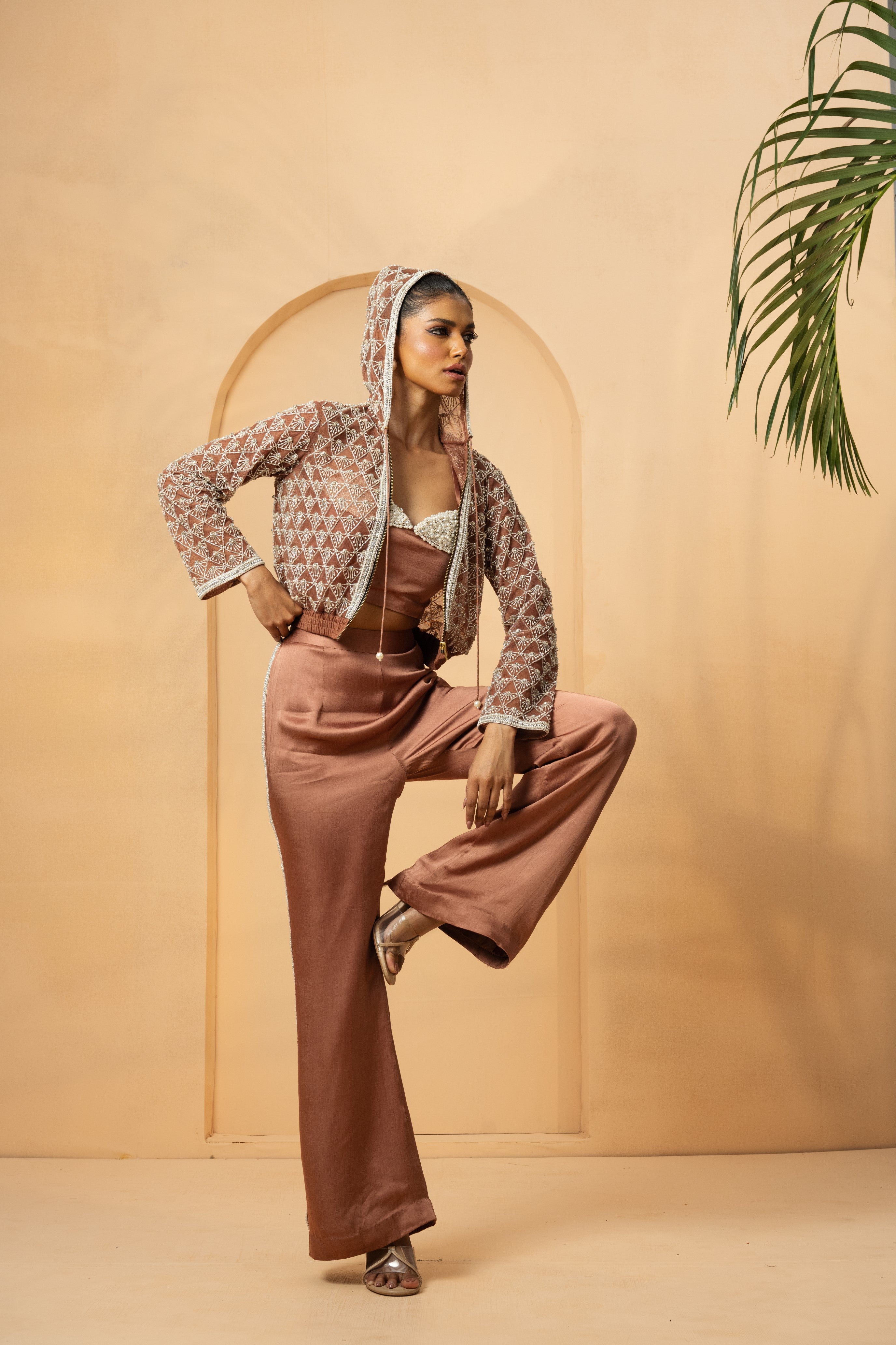 Metallic rose gold co-ord set with pearl and crystal embellishments, featuring a net hoodie.