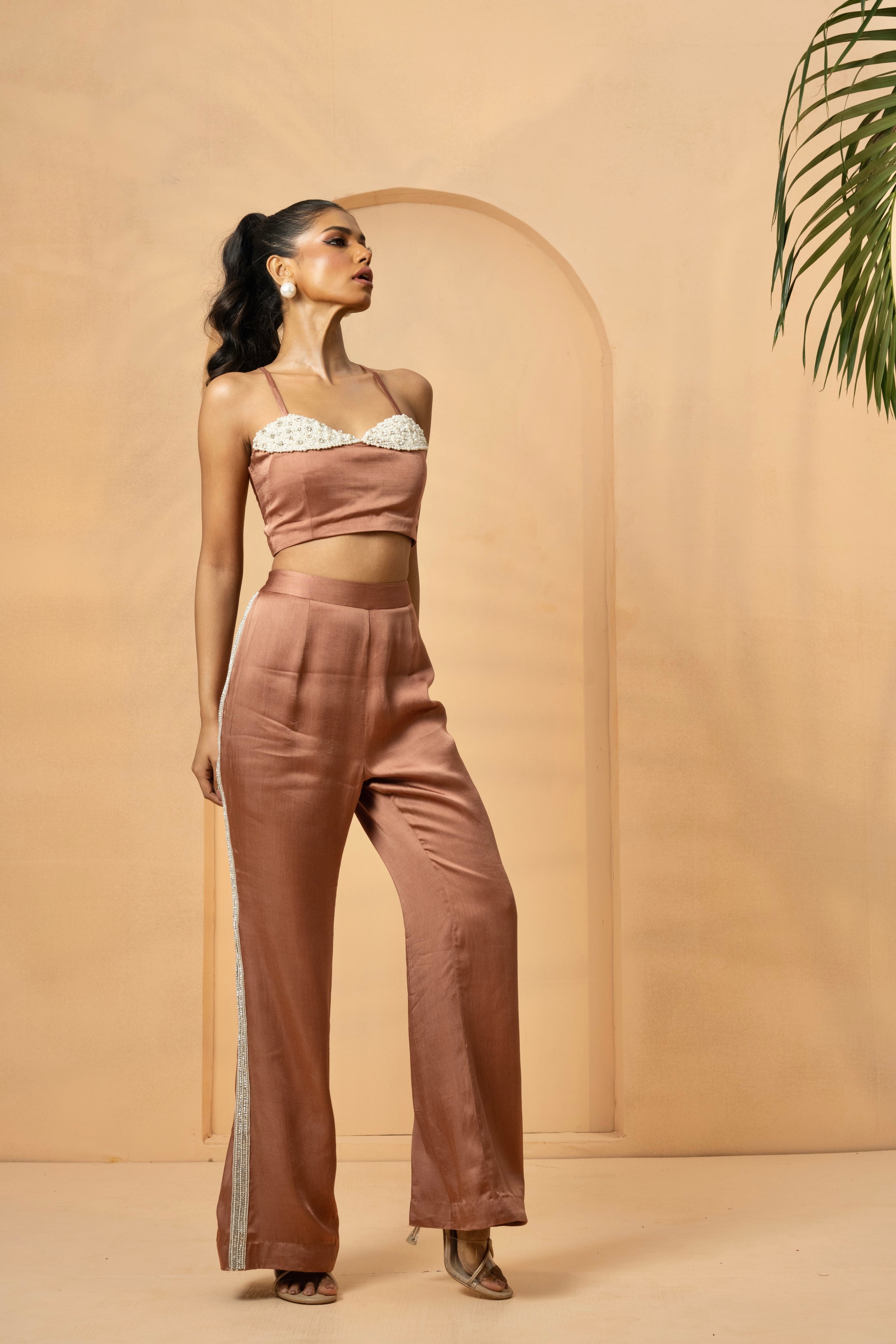 Metallic rose gold pant and top set with intricate pearl and crystal embellishments.