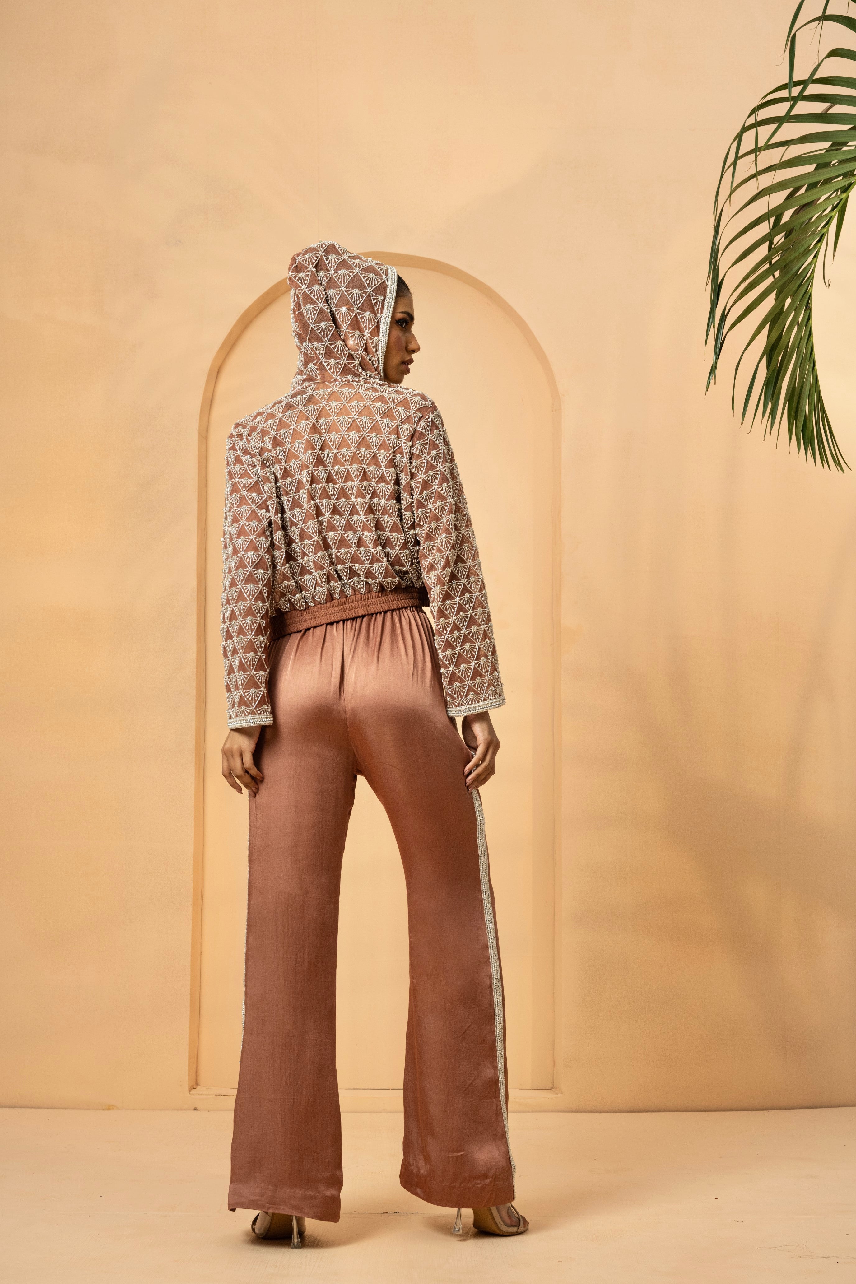 Metallic rose gold co-ord set with pearl and crystal embellishments, featuring a net hoodie.