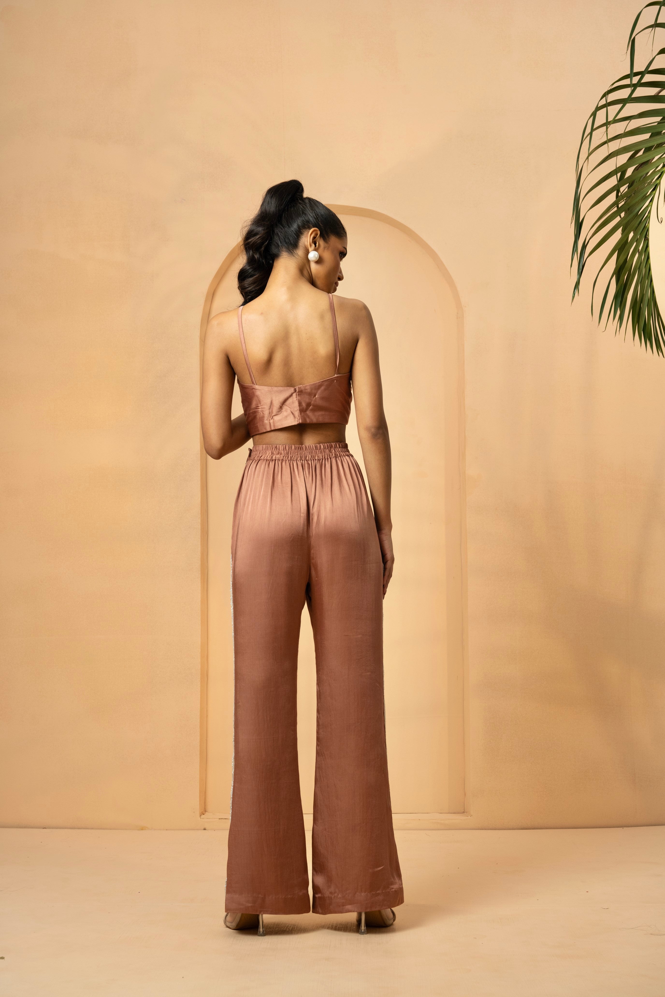 Metallic rose gold pant and top set with intricate pearl and crystal embellishments.