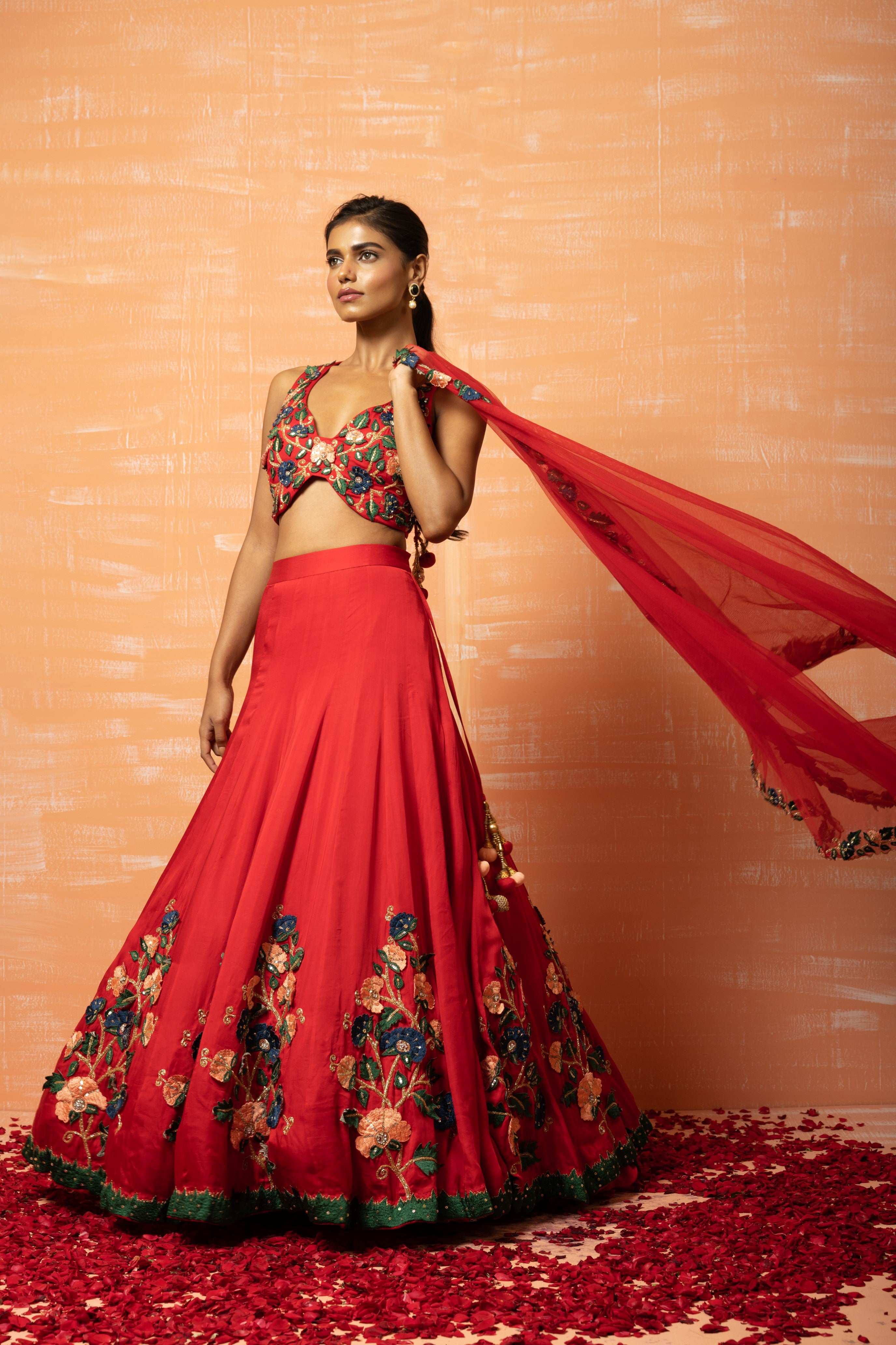 Red modal silk lehenga with 3D applique embroidery and a soft net dupatta.