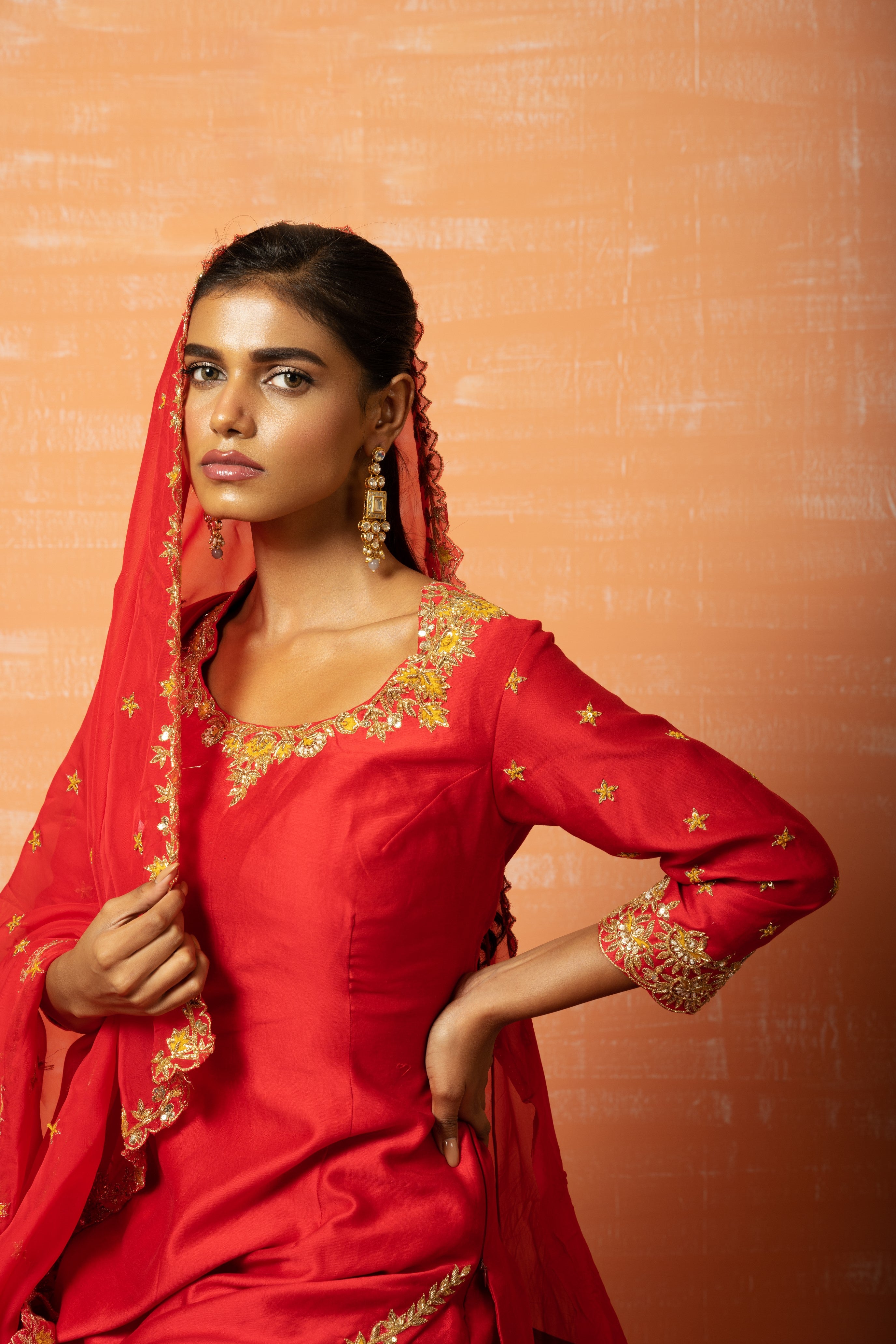 Red chanderi silk kurta set with hand-embroidered organza dupatta.