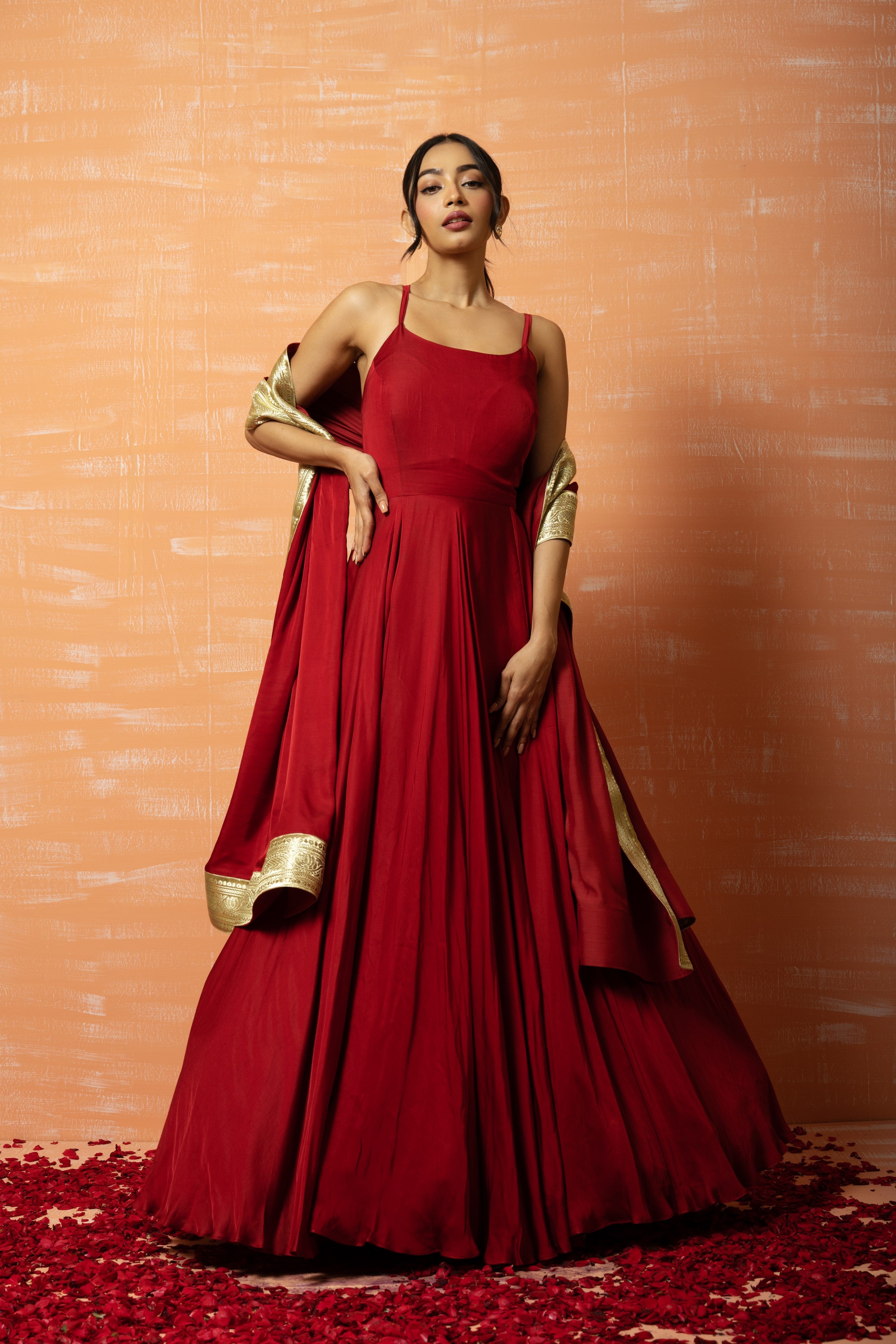 Deep red modal gown with a dupatta accented with zari lace.