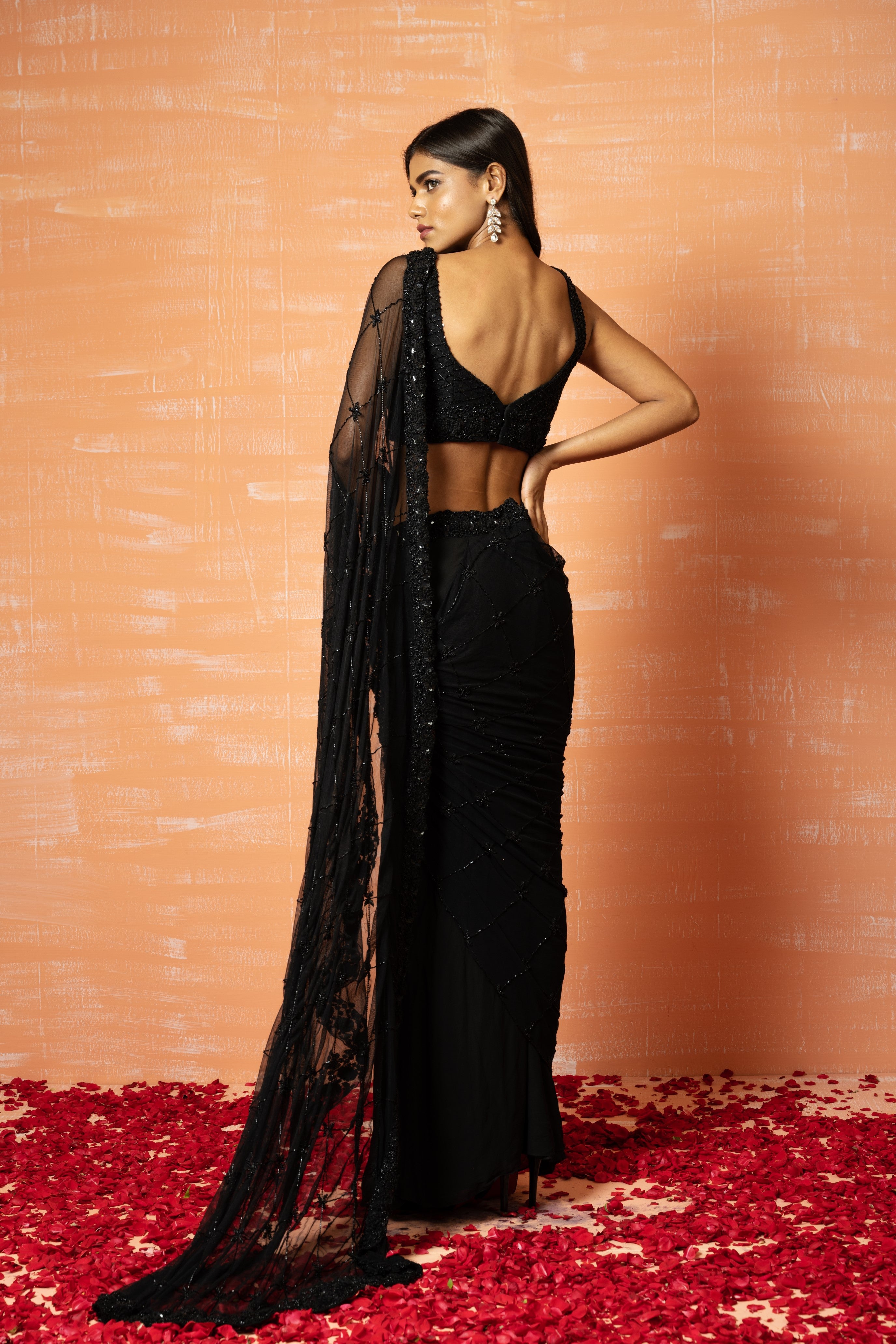 Black pre-stitched saree with hand embroidery in soft net and georgette.