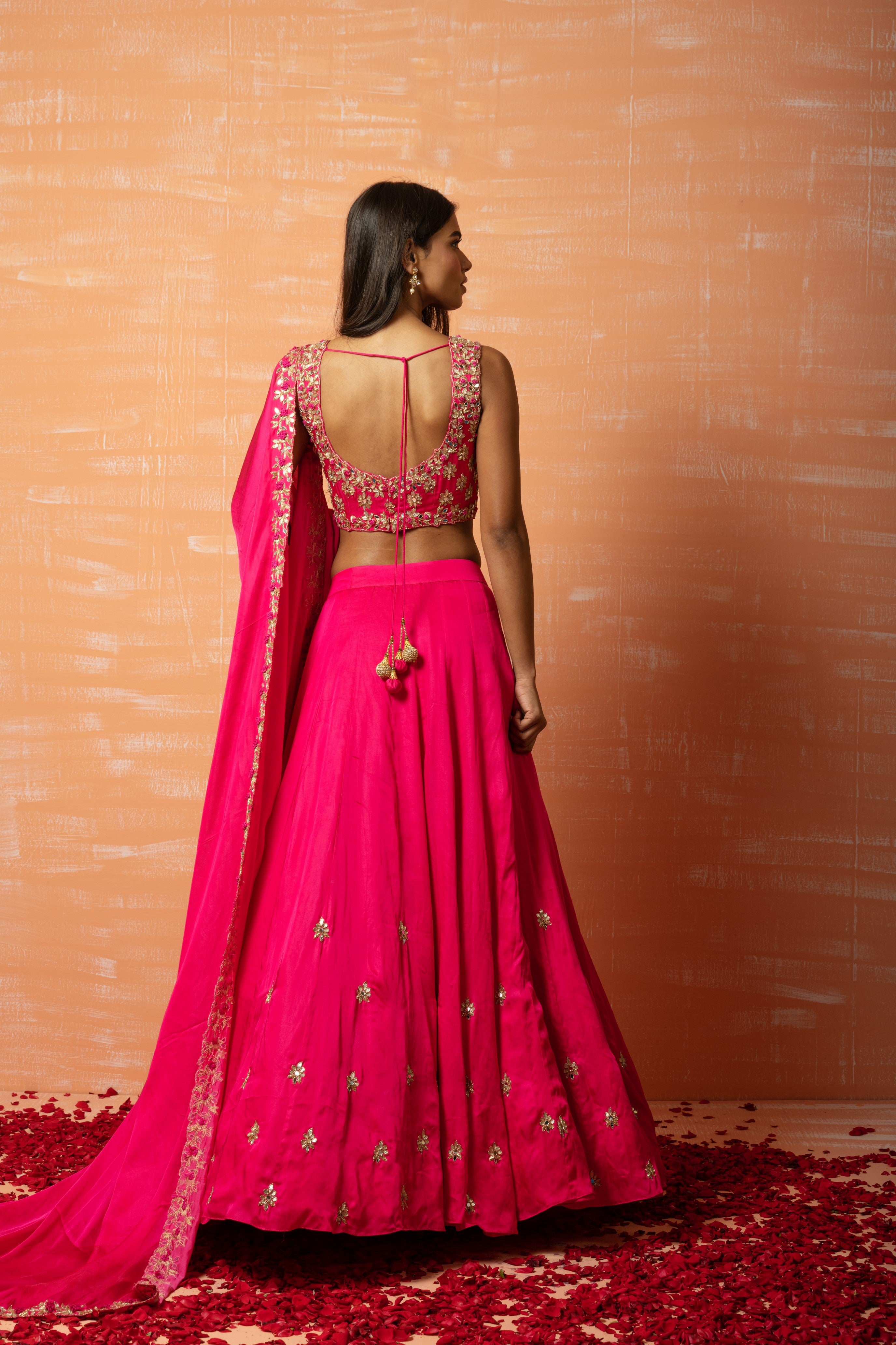 Hot pink hand-embroidered lehenga in modal silk for a stunning traditional look.
