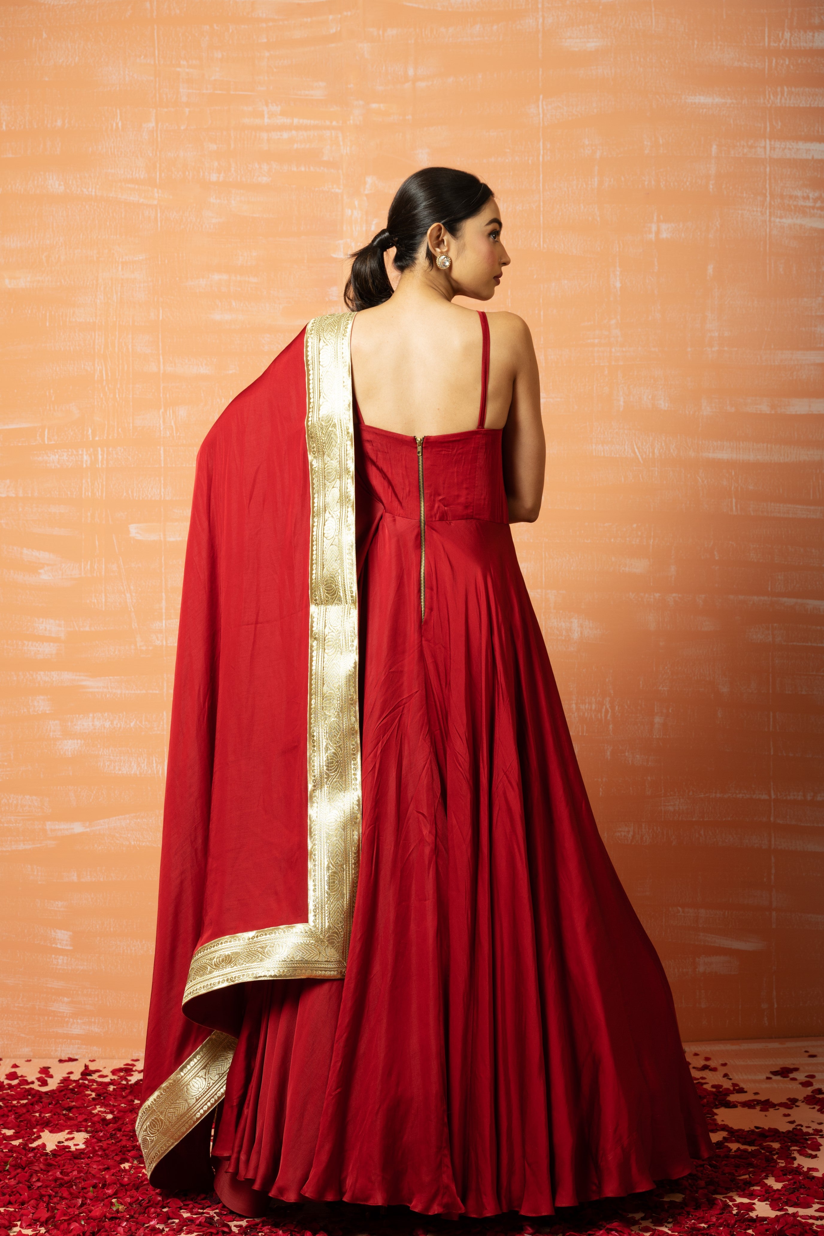 Deep red modal gown with a dupatta accented with zari lace.