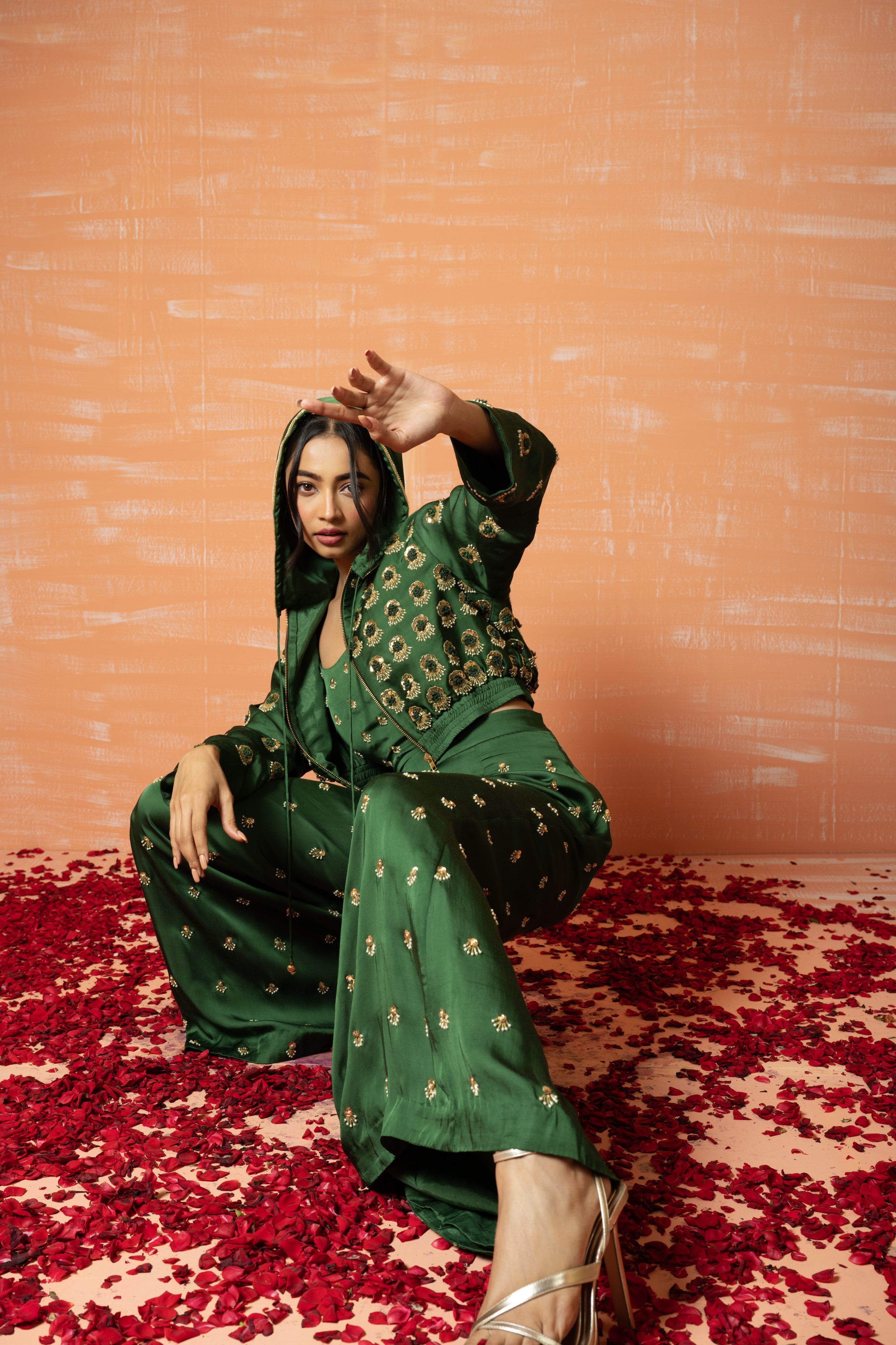 Mehendi green hoodie and palazzo set with hand embroidery.