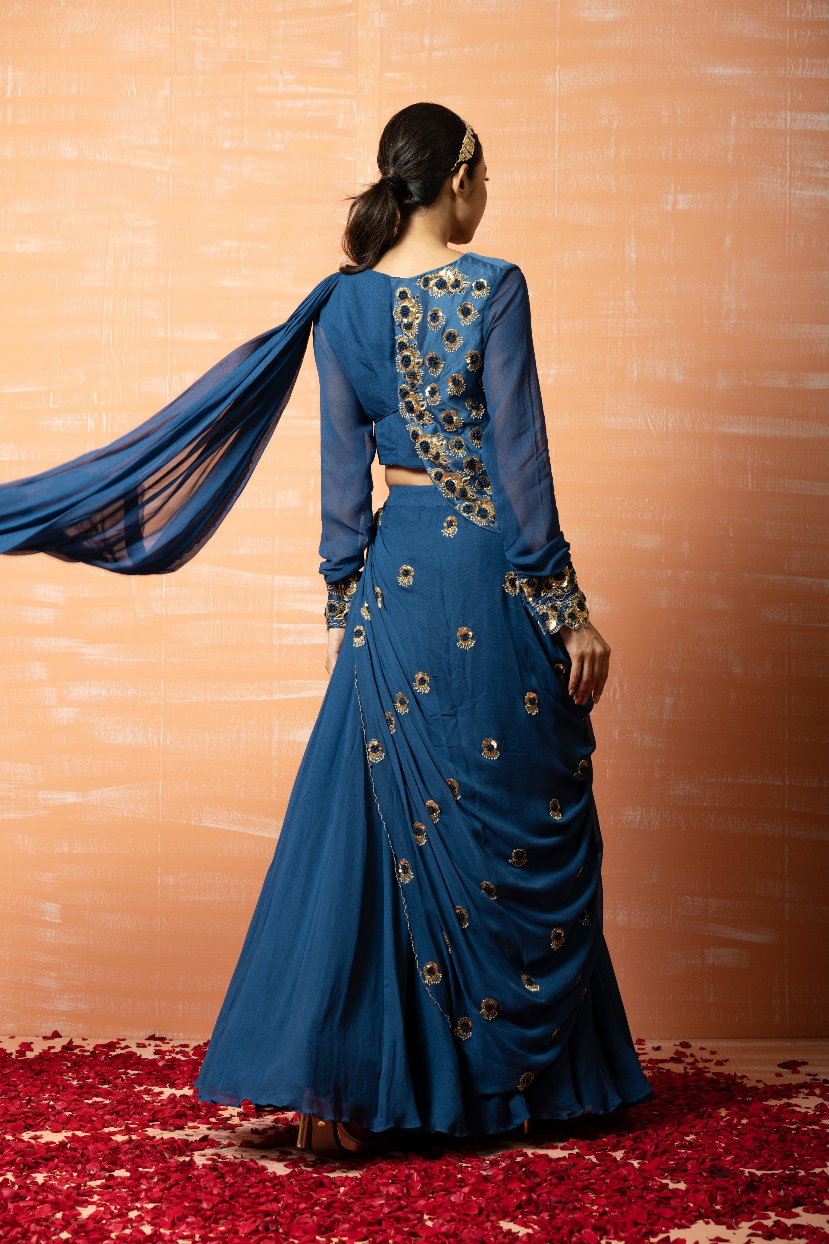 Blue sharara saree with a hand-embroidered jacket in georgette fabric.