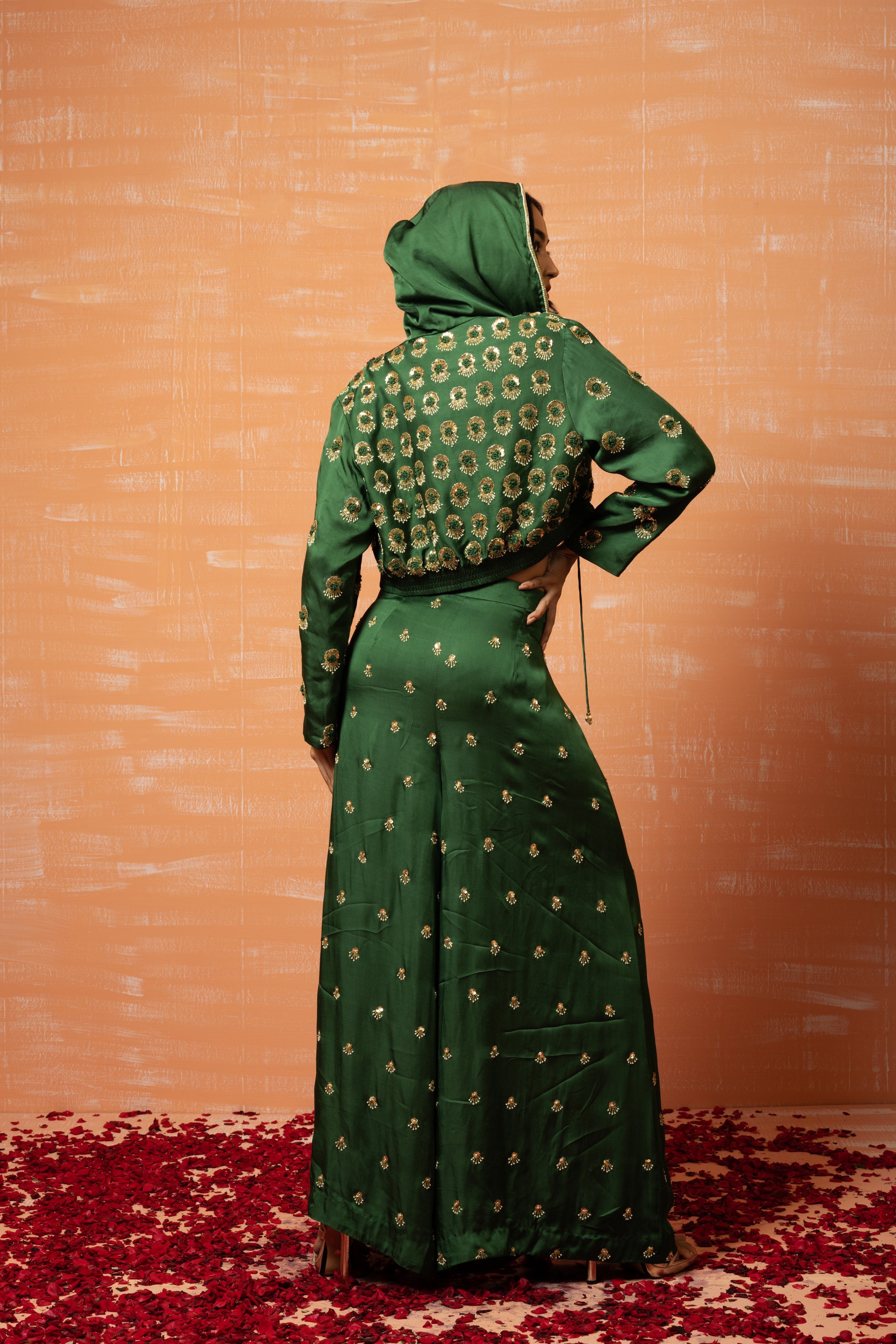 Mehendi green hoodie and palazzo set with hand embroidery.