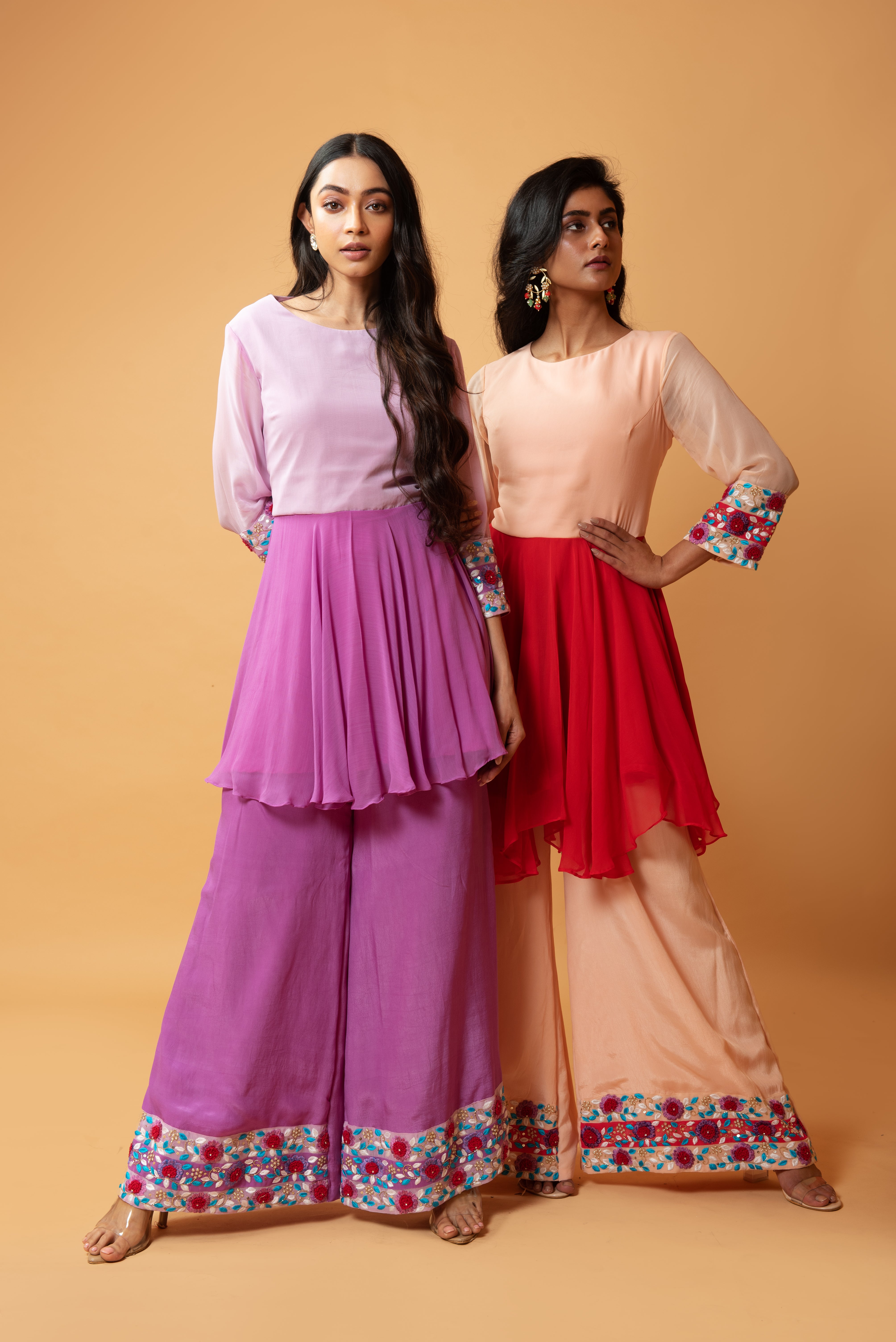 Red double-shaded sharara set with intricate floral hand embroidery.