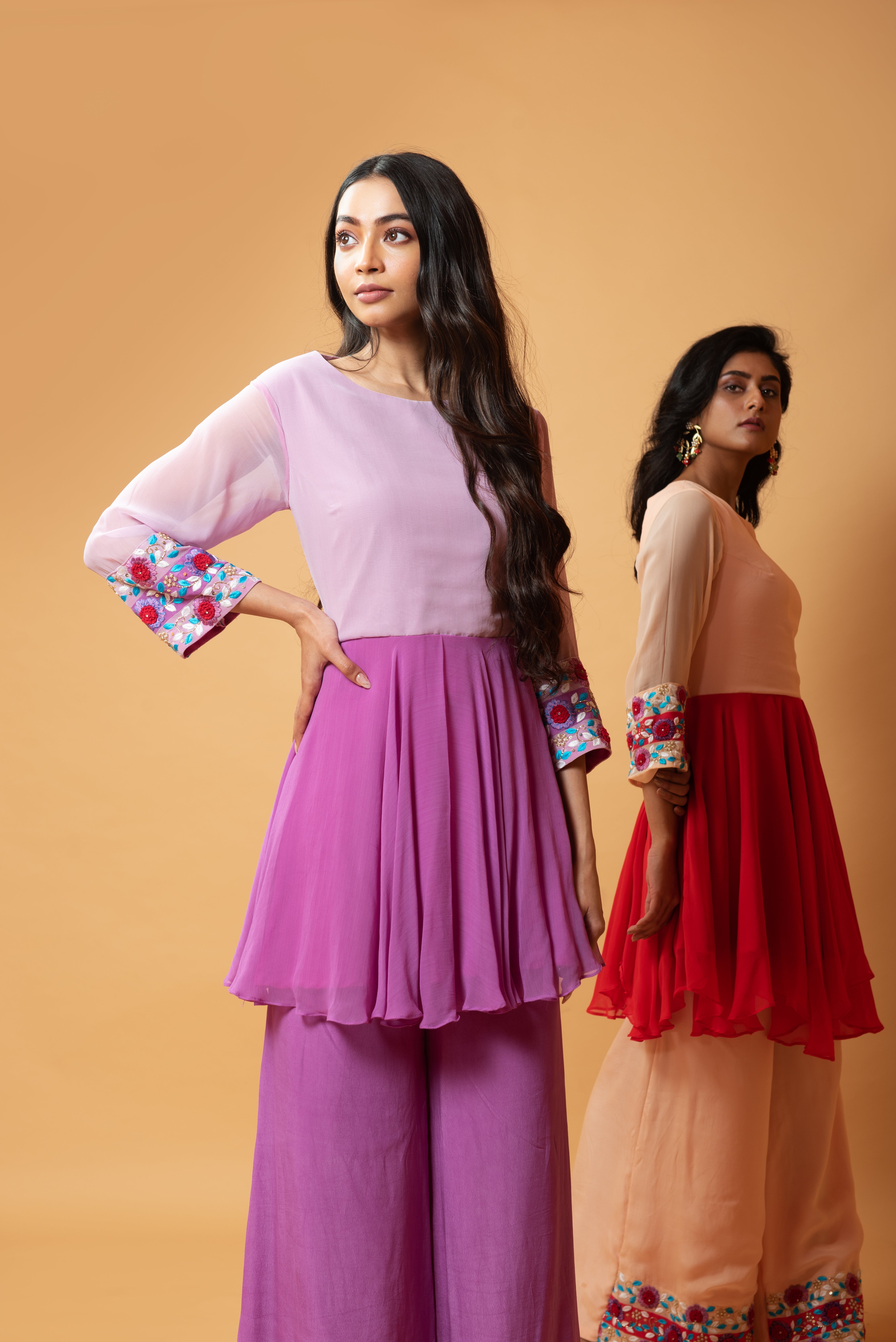 Red double-shaded sharara set with intricate floral hand embroidery.