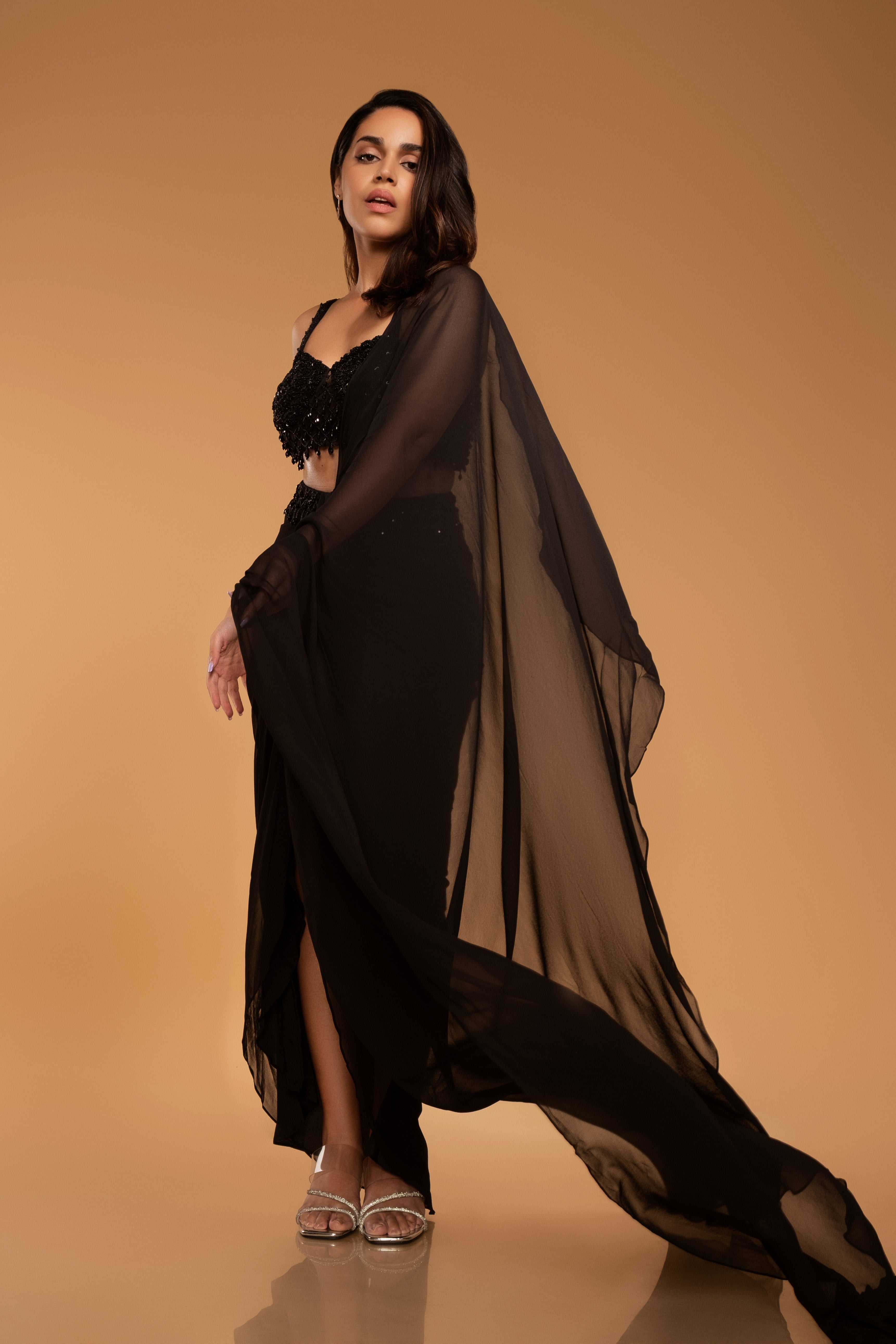 Naila Garewal in a black georgette saree with a hand-embroidered corset blouse.