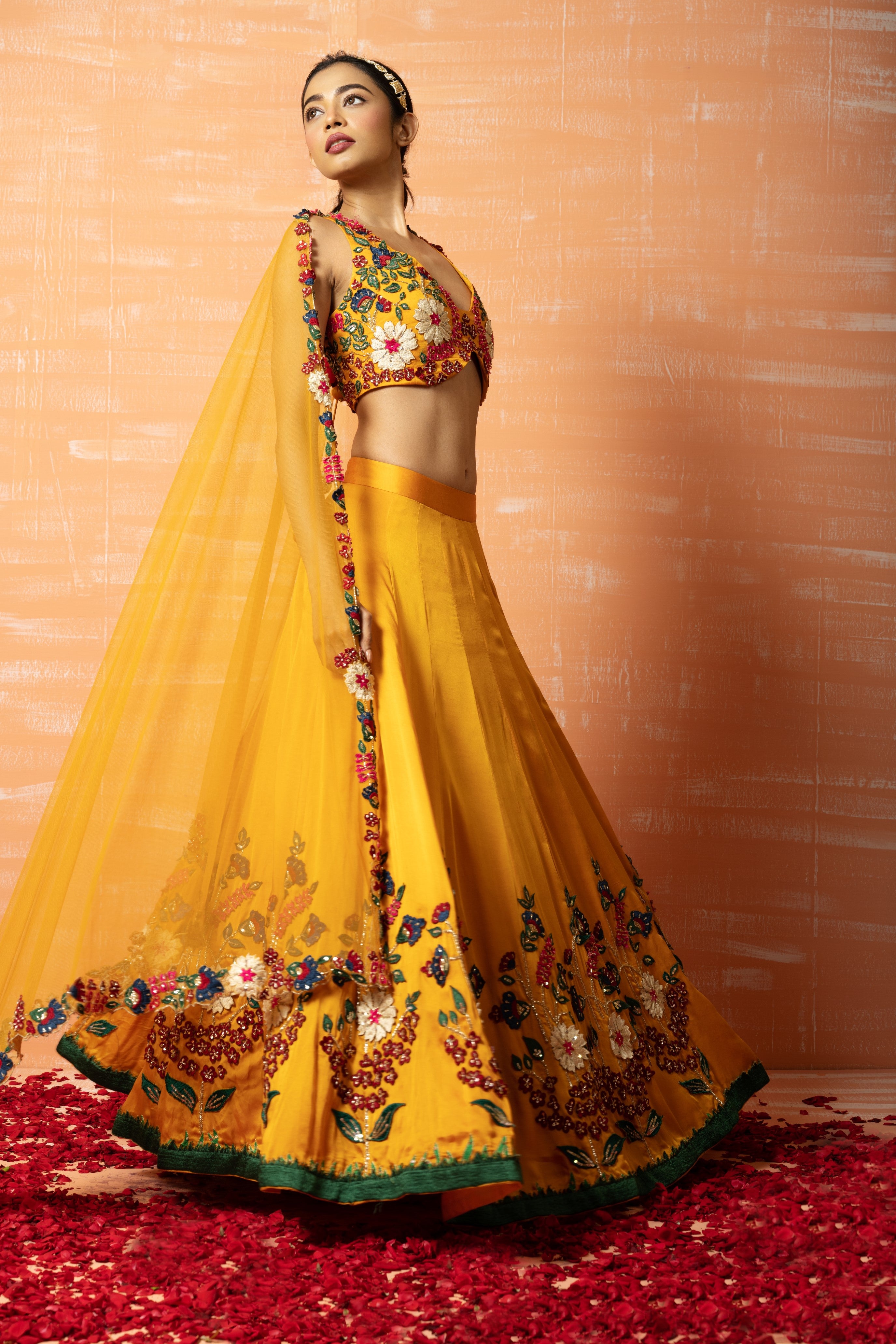 Mustard yellow 3D lehenga set with applique embroidery and matching embroidered dupatta.
