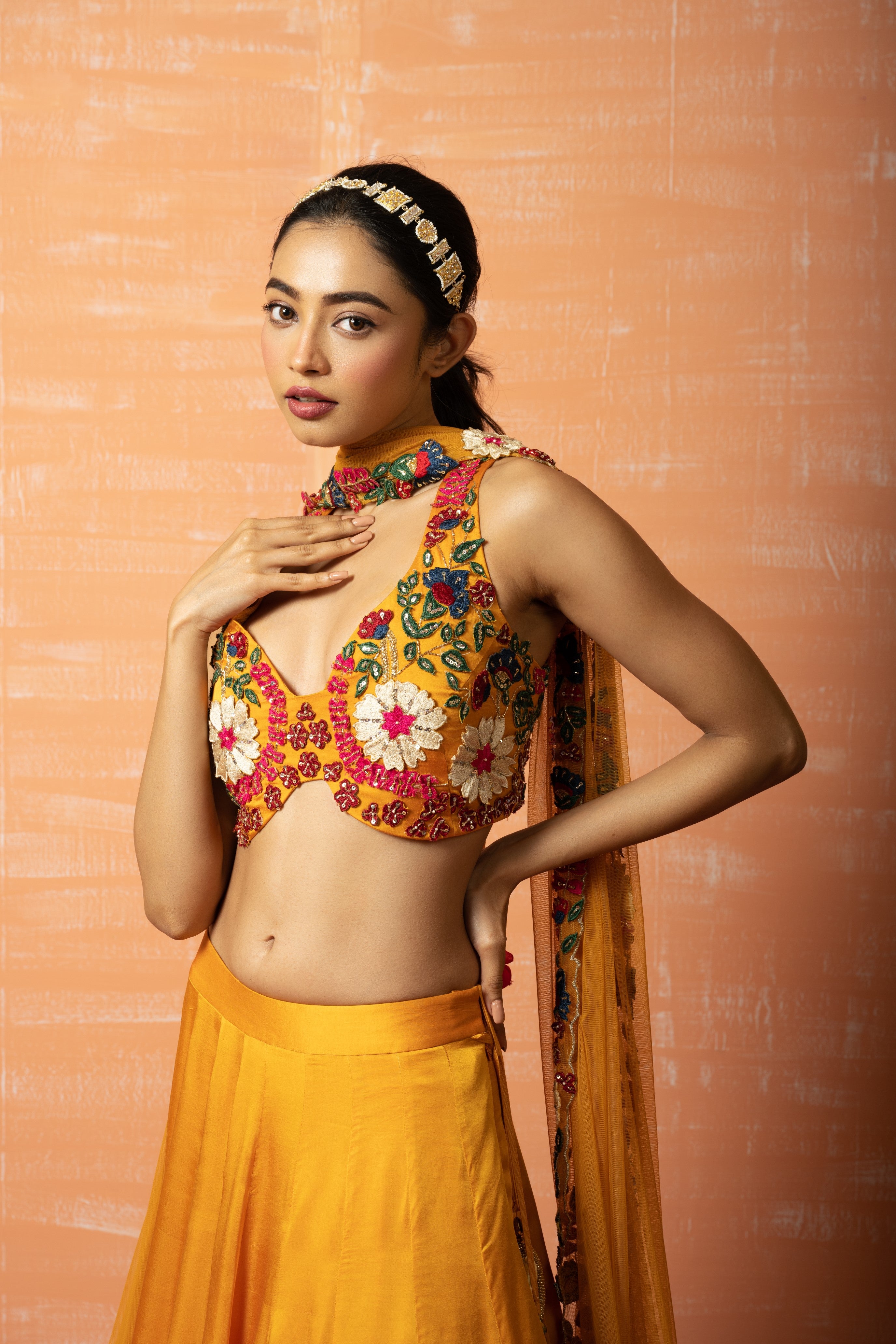 Mustard yellow 3D lehenga set with applique embroidery and matching embroidered dupatta.