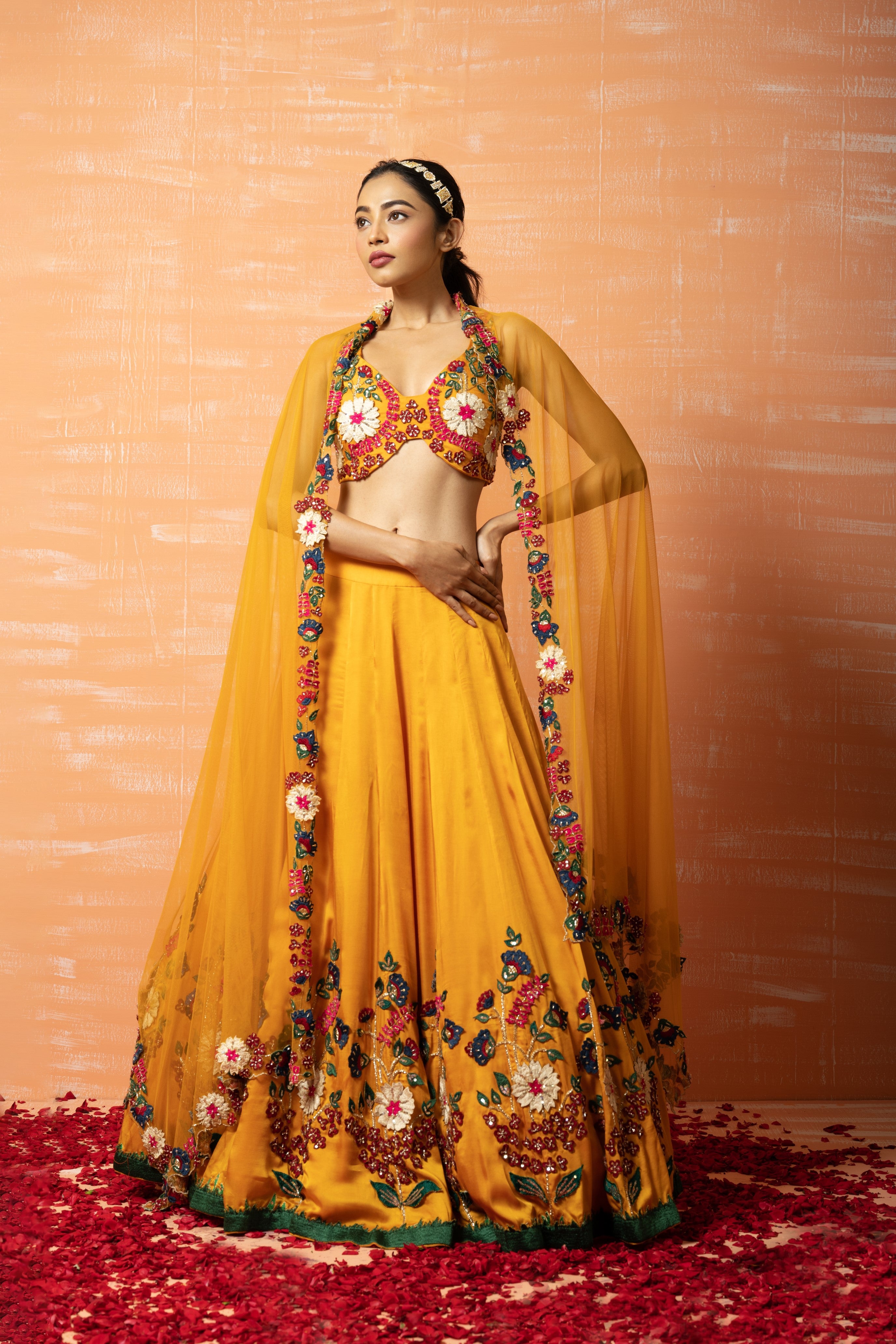 Mustard yellow 3D lehenga set with applique embroidery and matching embroidered dupatta.