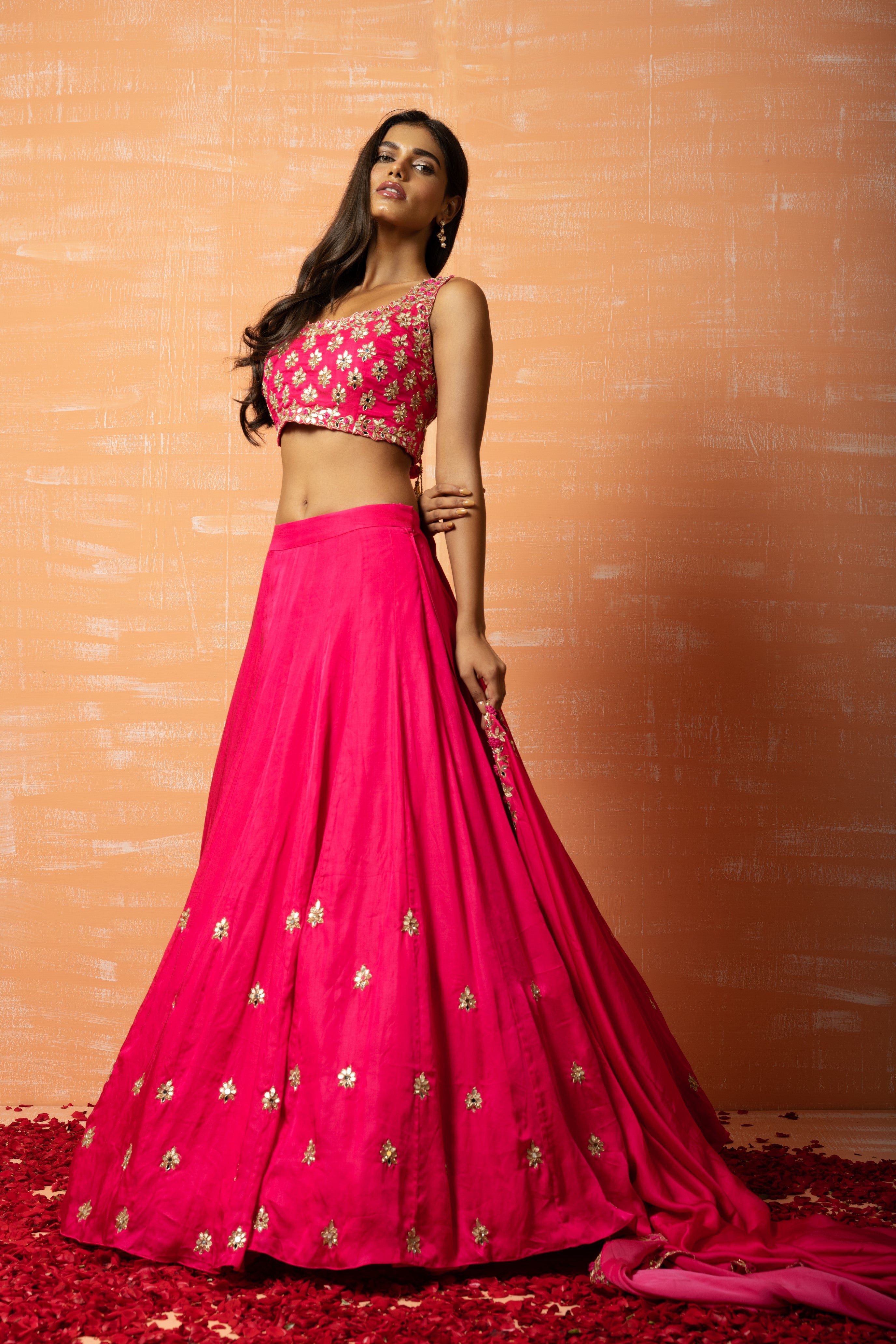 Hot pink hand-embroidered lehenga in modal silk for a stunning traditional look.