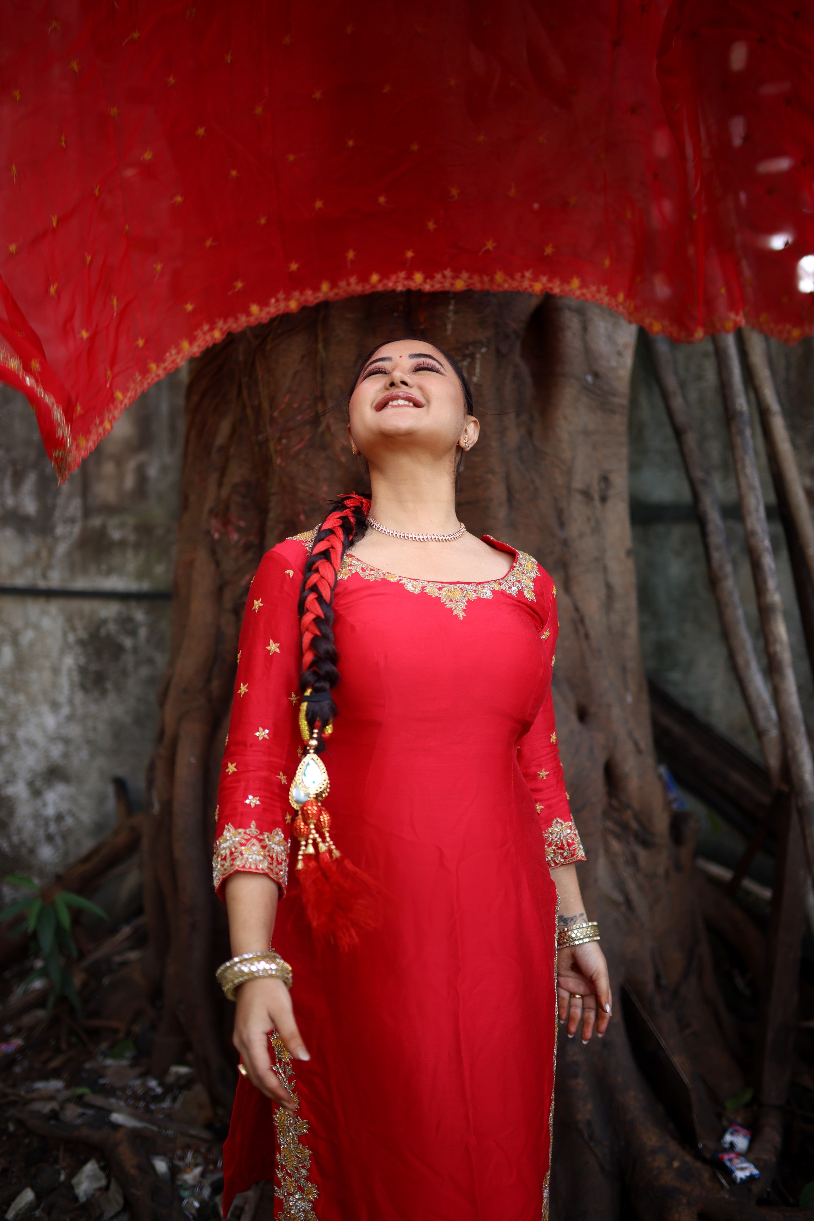 Rashami Desai in a red chanderi silk kurta set with hand-embroidered organza dupatta.
