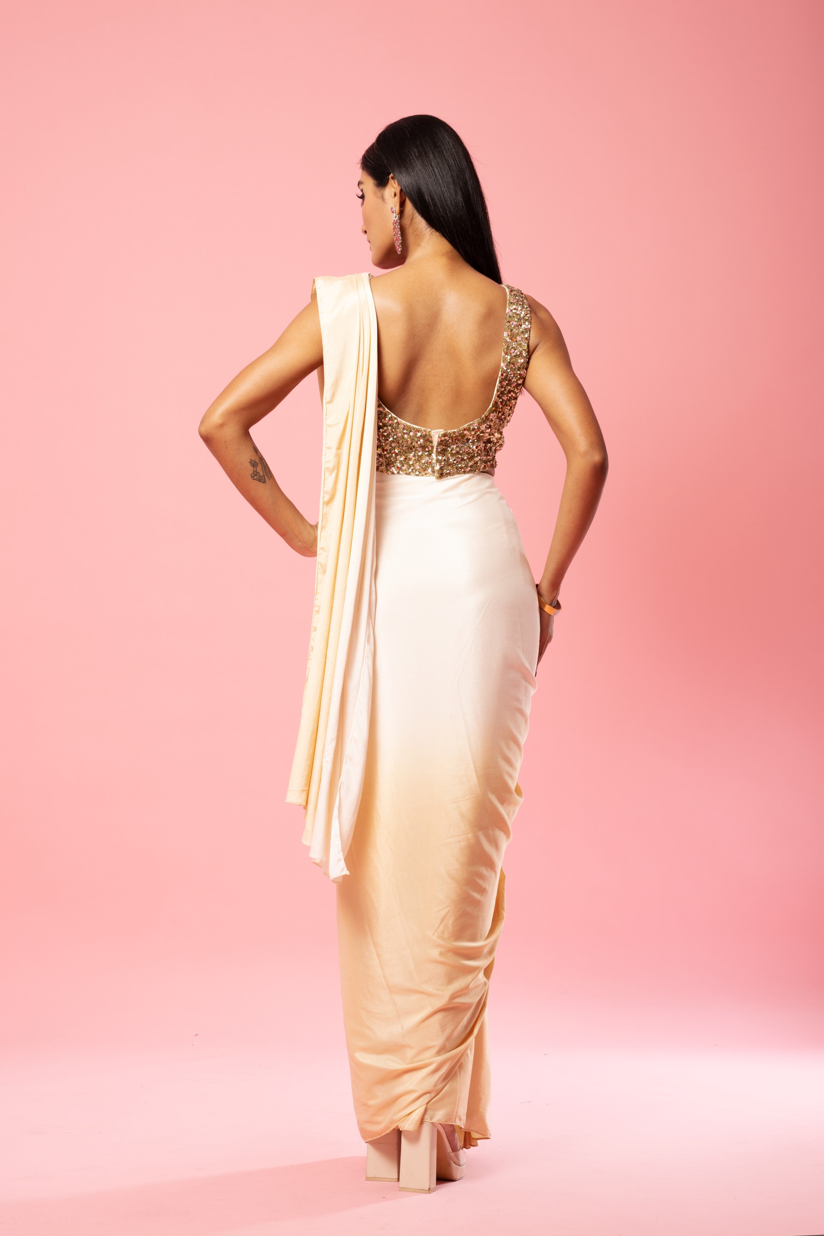 Ivory and golden ombre saree with sequin embroidered blouse.