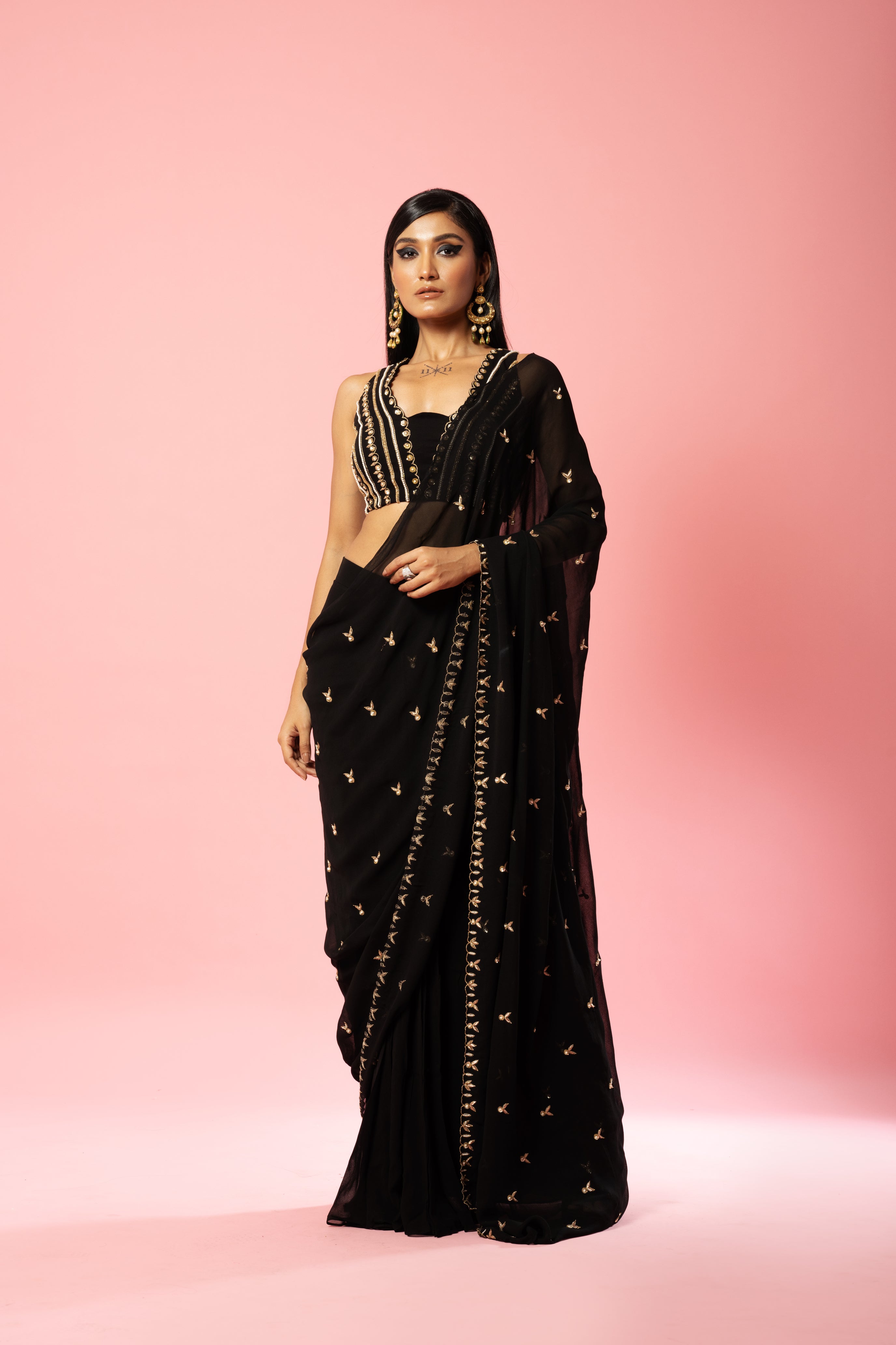 Black pre-stitched saree with hand-embroidered blouse and pallu.