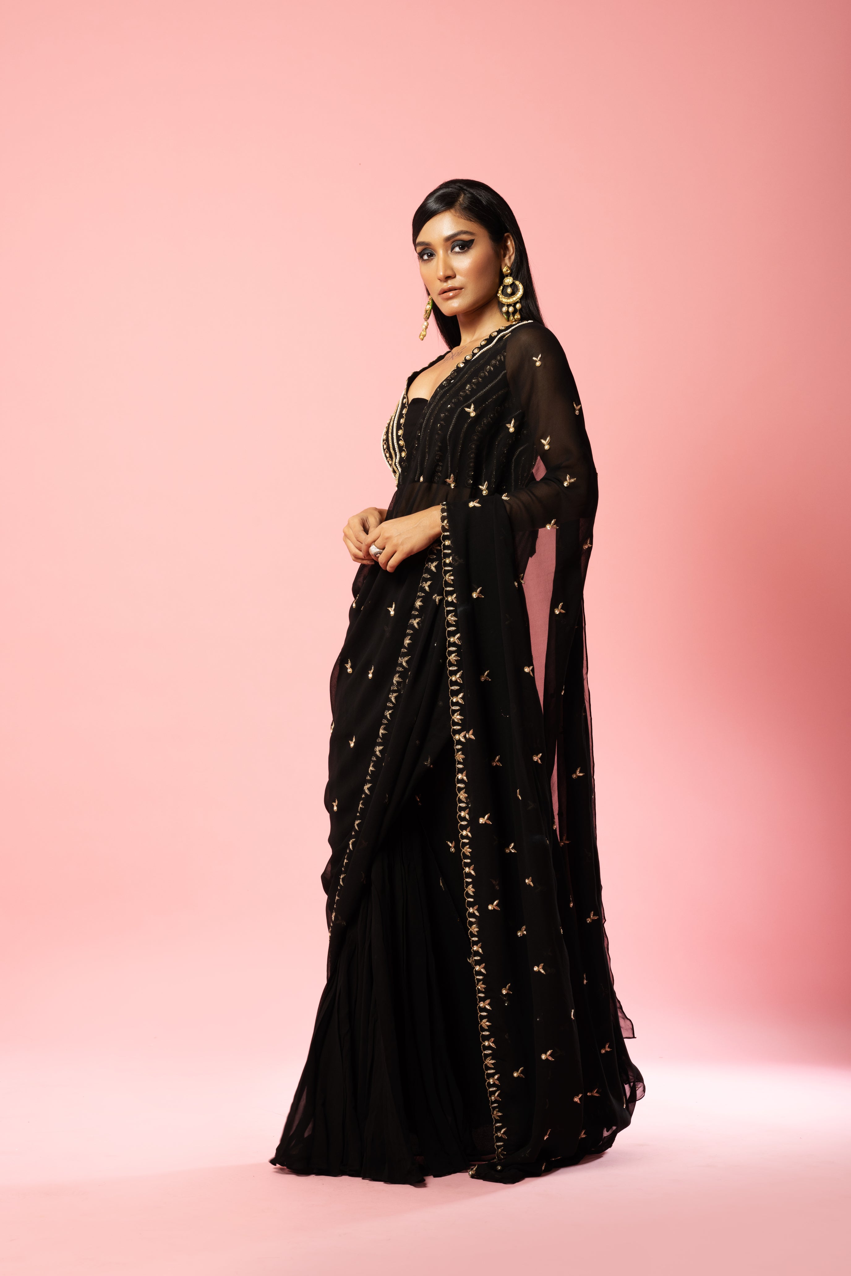 Black pre-stitched saree with hand-embroidered blouse and pallu.