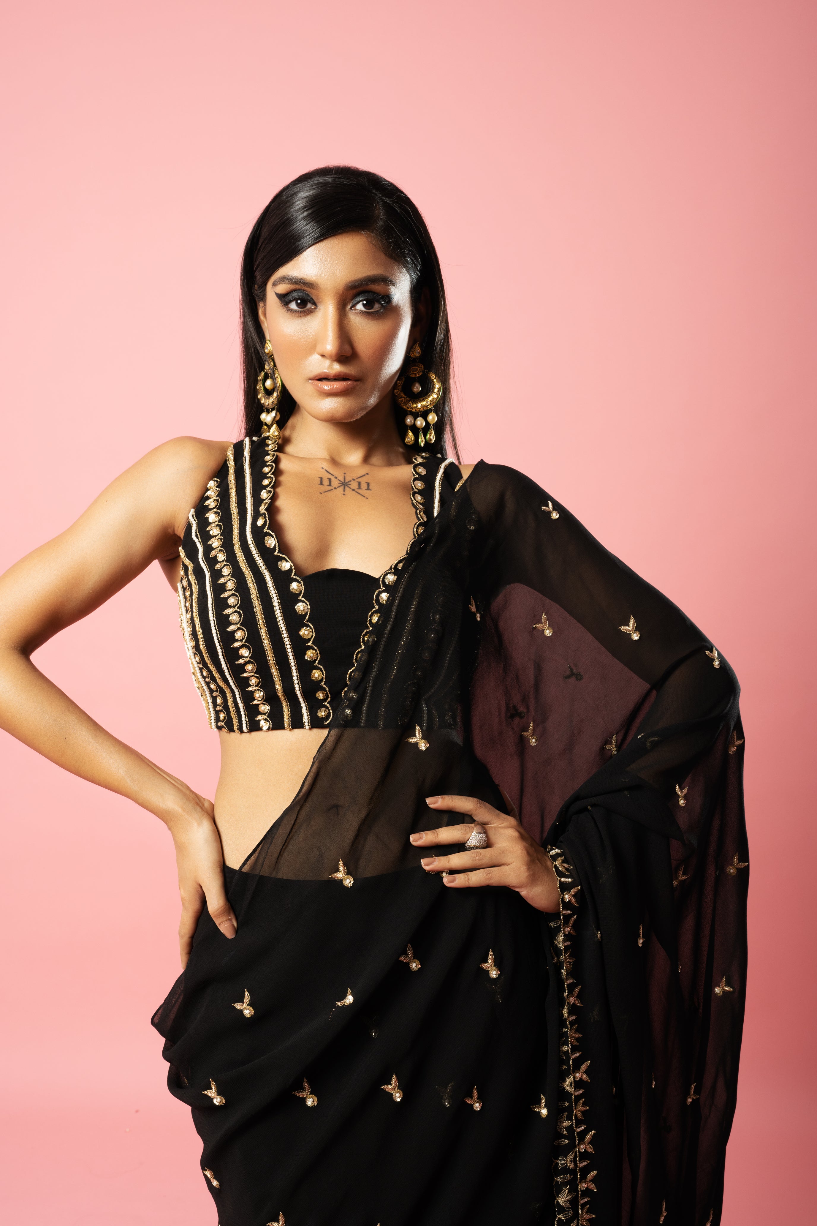 Black pre-stitched saree with hand-embroidered blouse and pallu.
