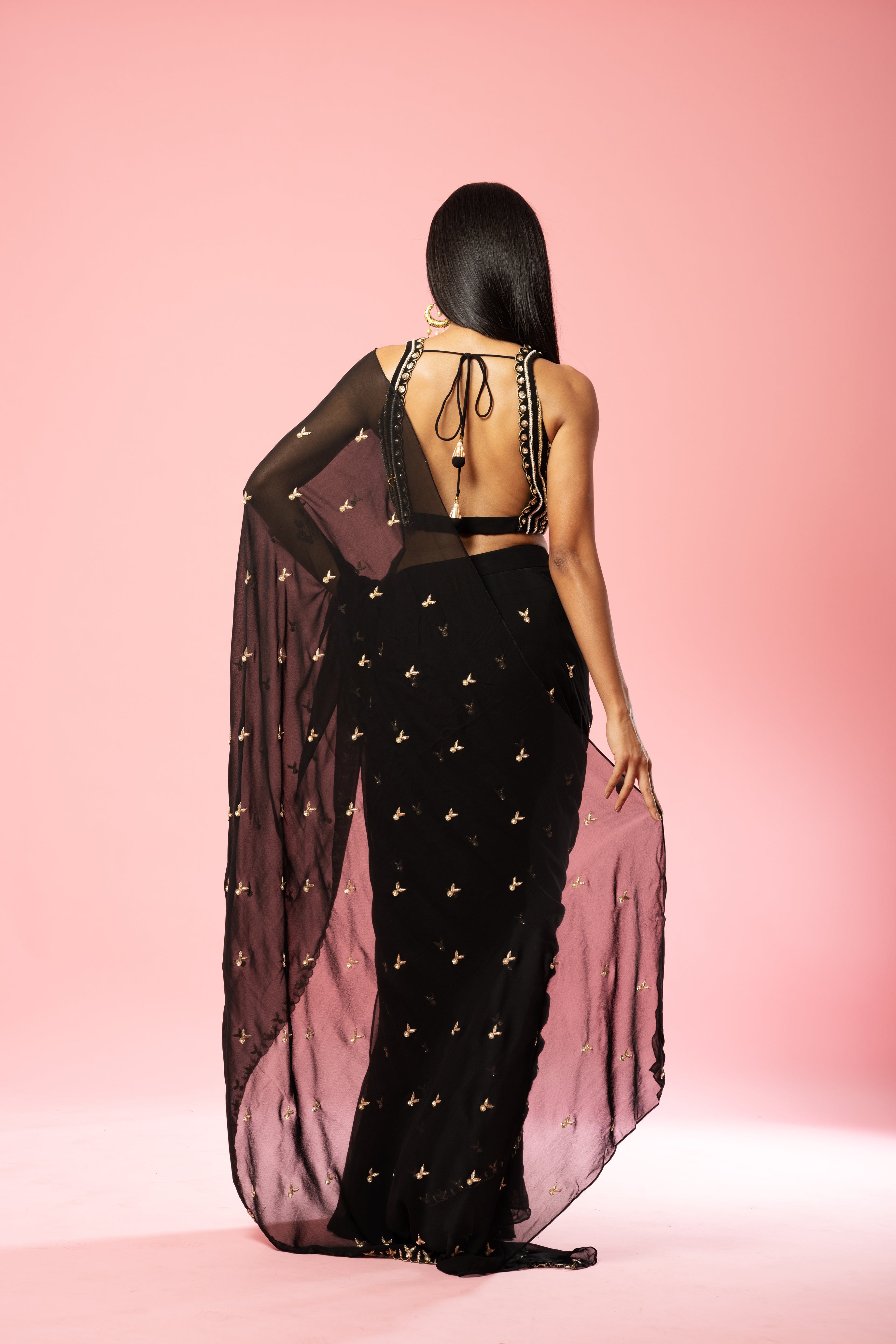 Black pre-stitched saree with hand-embroidered blouse and pallu.