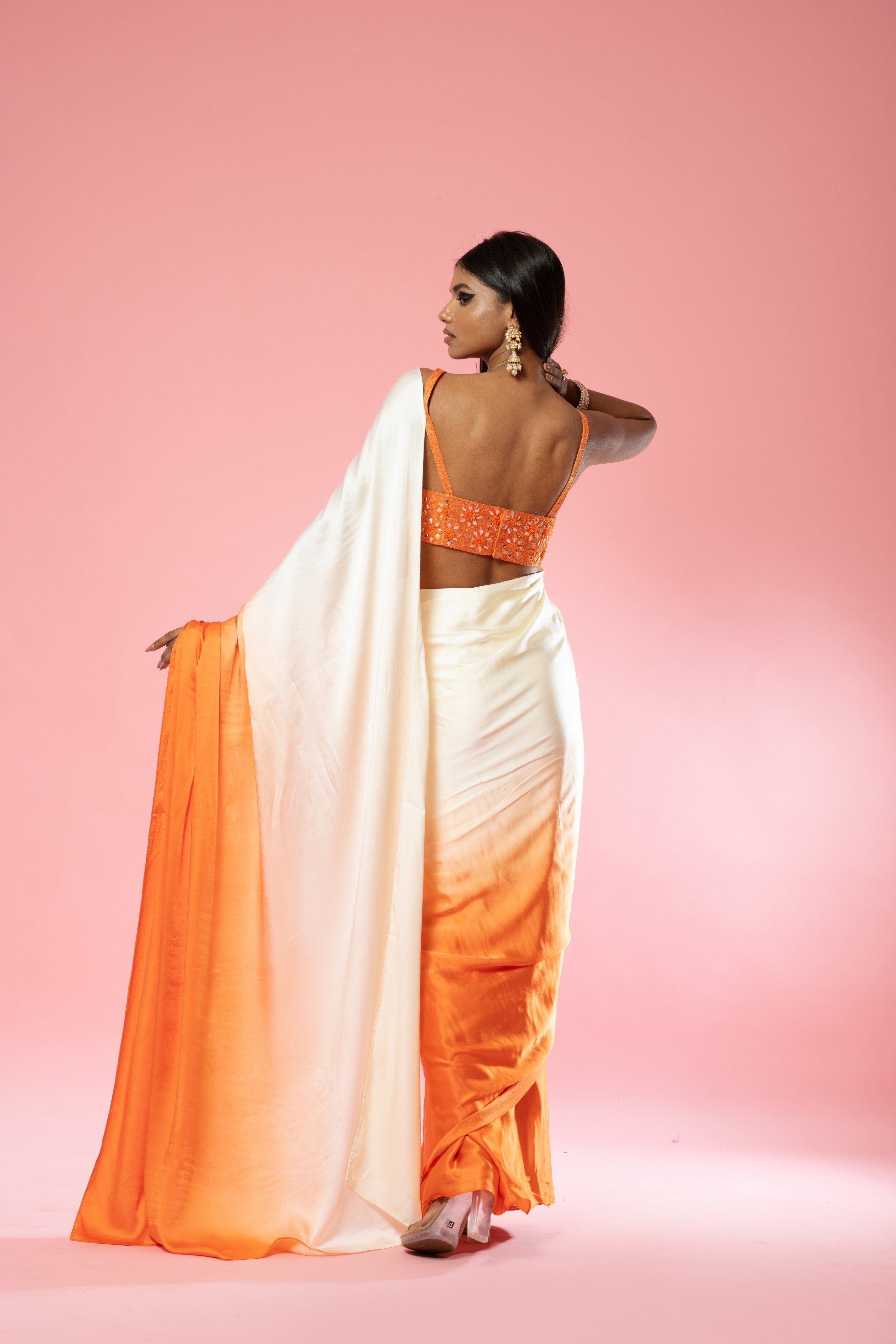 Ivory and orange ombre saree with hand-embroidered blouse.