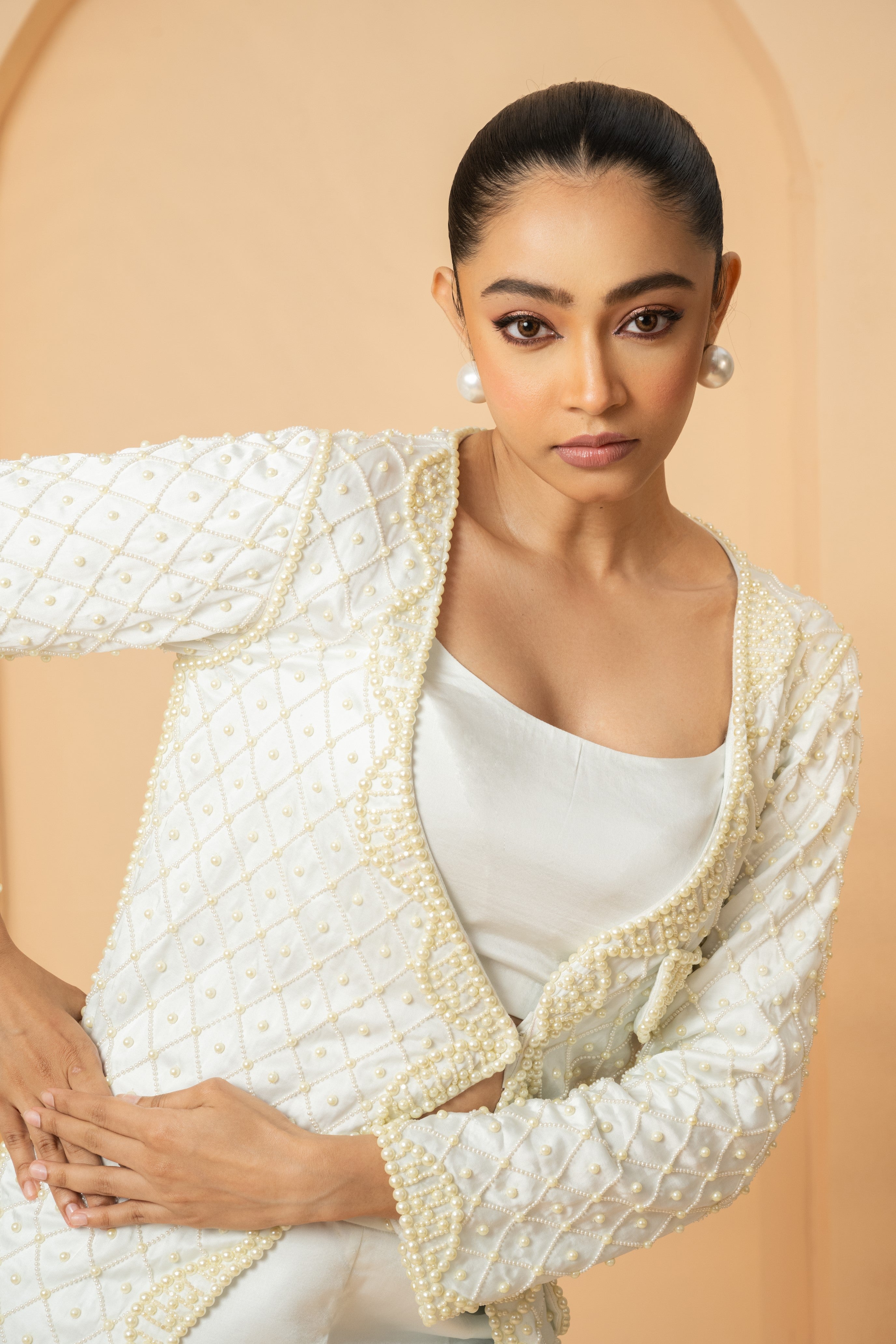 Ivory co-ord set with hand-embroidered blazer and trousers.