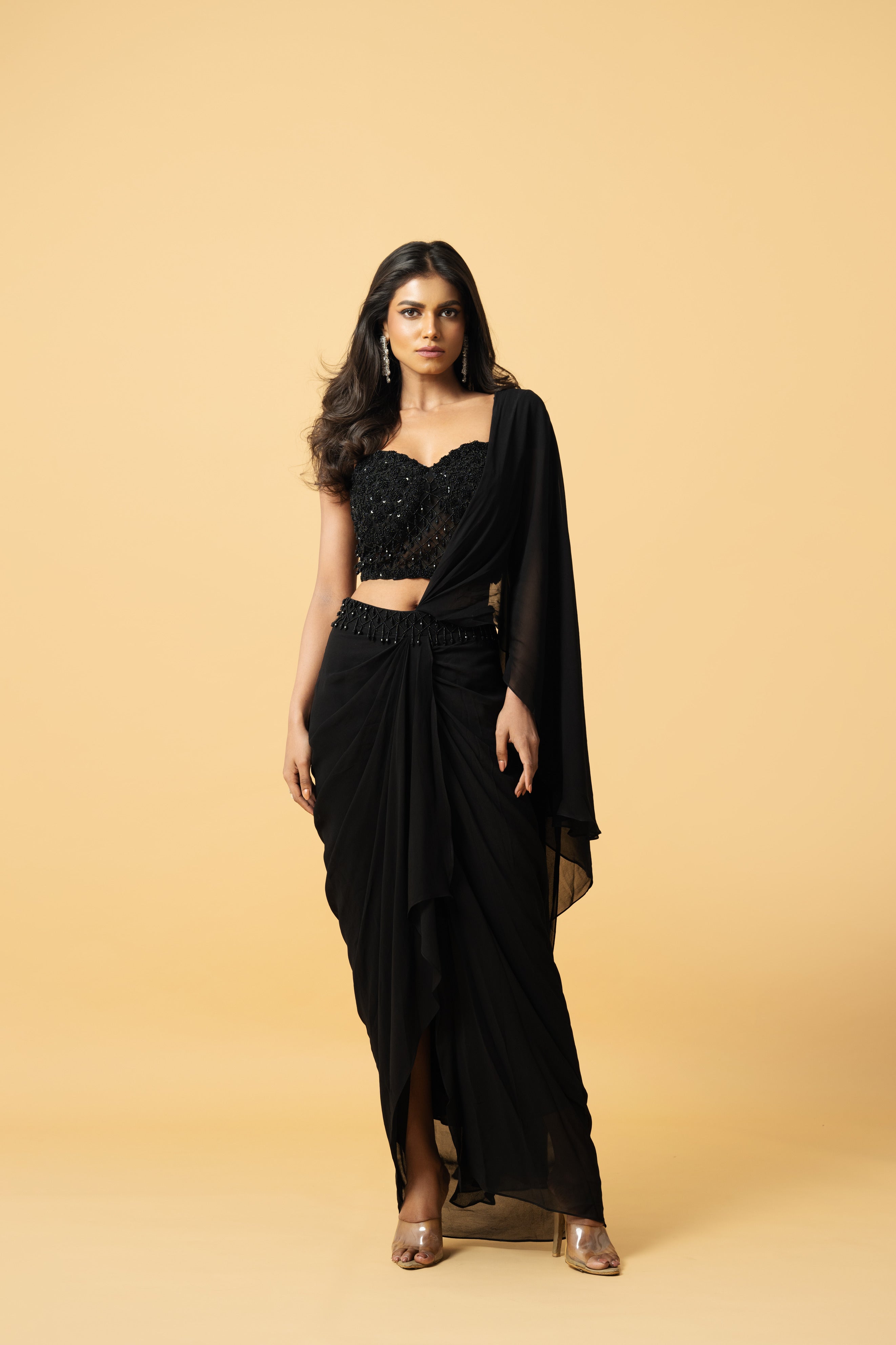 Black georgette saree with a corset-style hand-embroidered blouse.