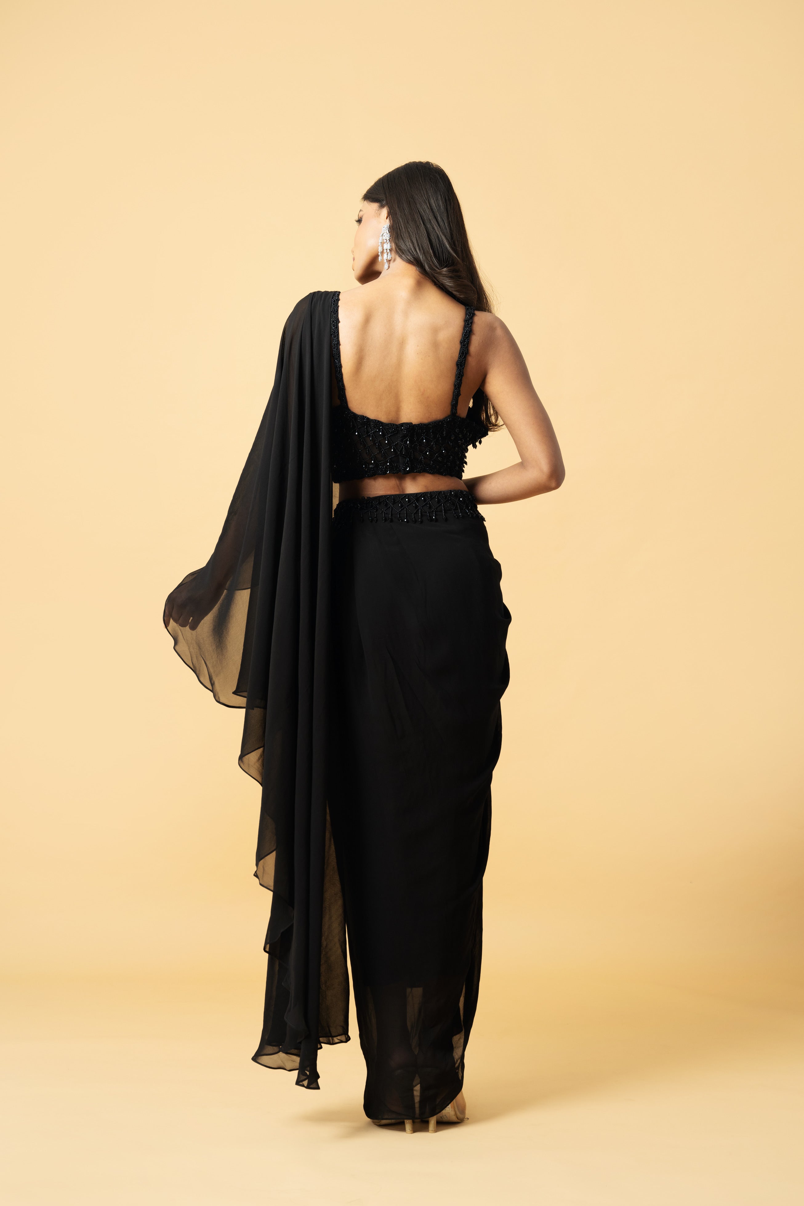 Black georgette saree with a corset-style hand-embroidered blouse.