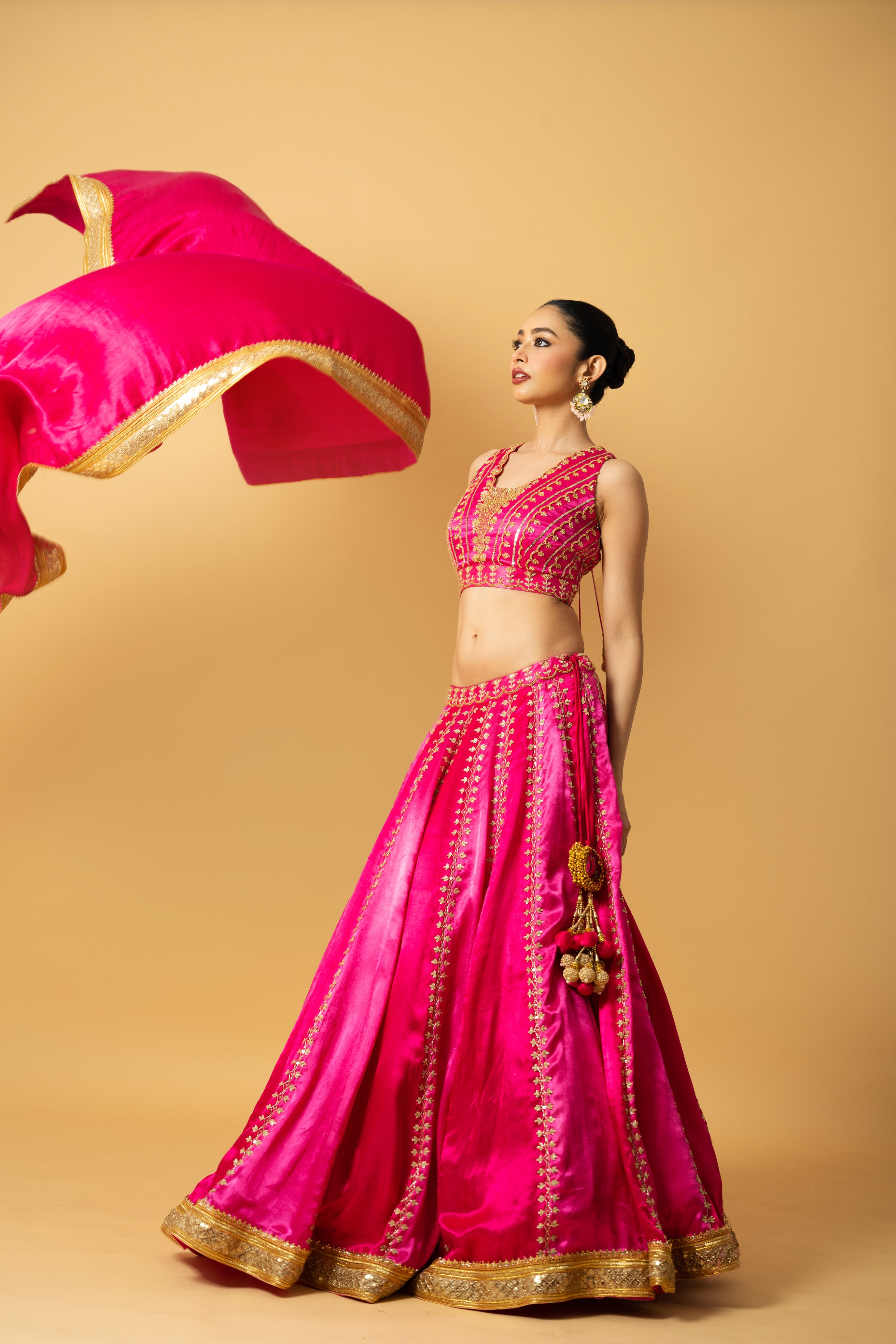 Pink ombré modal satin lehenga with hand embroidery and lace-edged dupatta.
