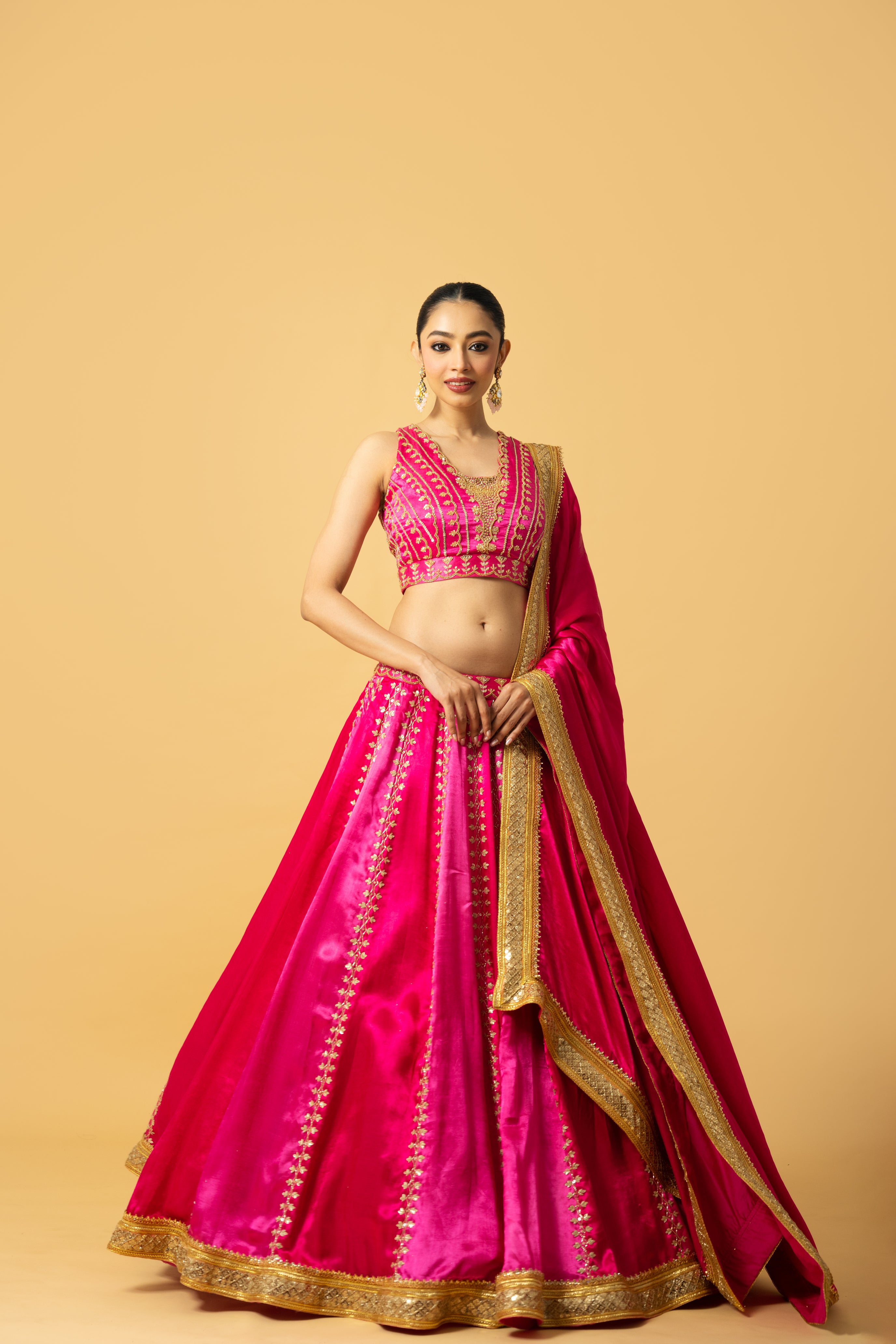 Pink ombré modal satin lehenga with hand embroidery and lace-edged dupatta.
