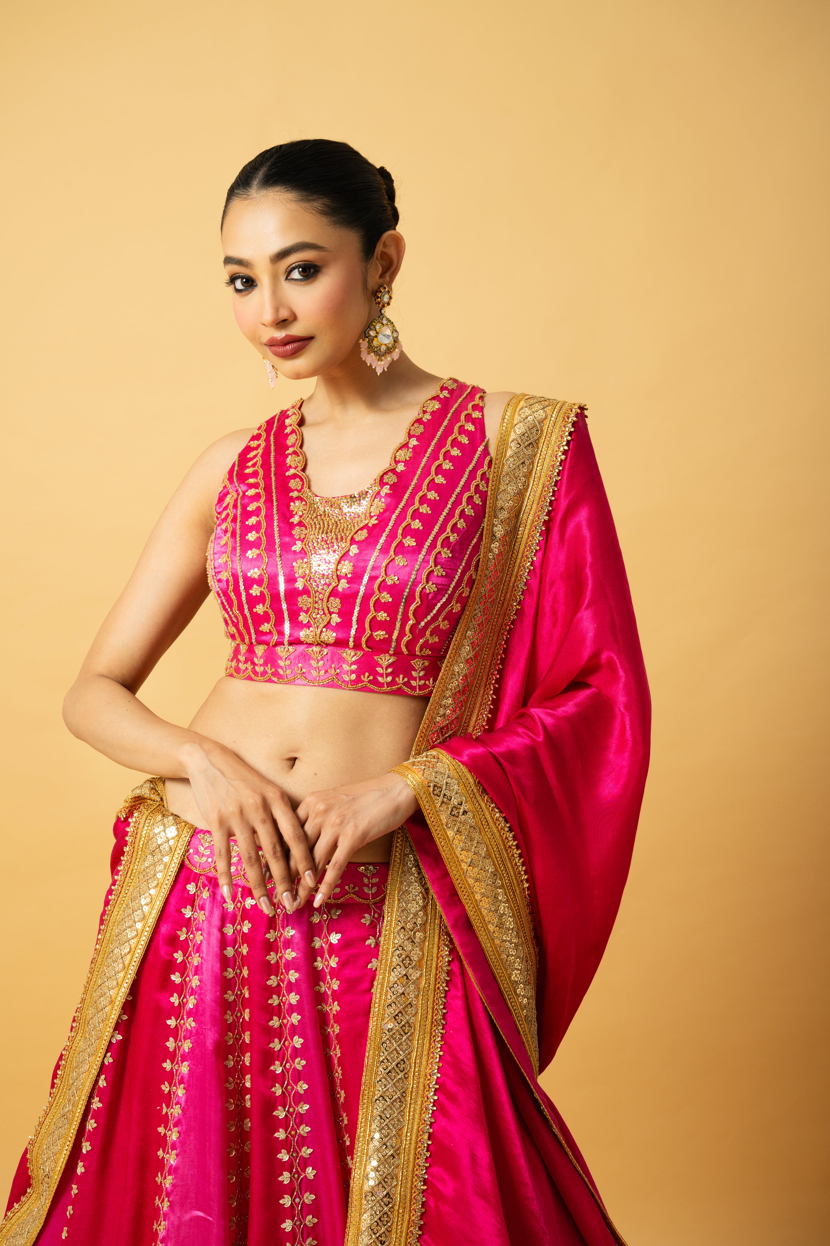 Pink ombré modal satin lehenga with hand embroidery and lace-edged dupatta.