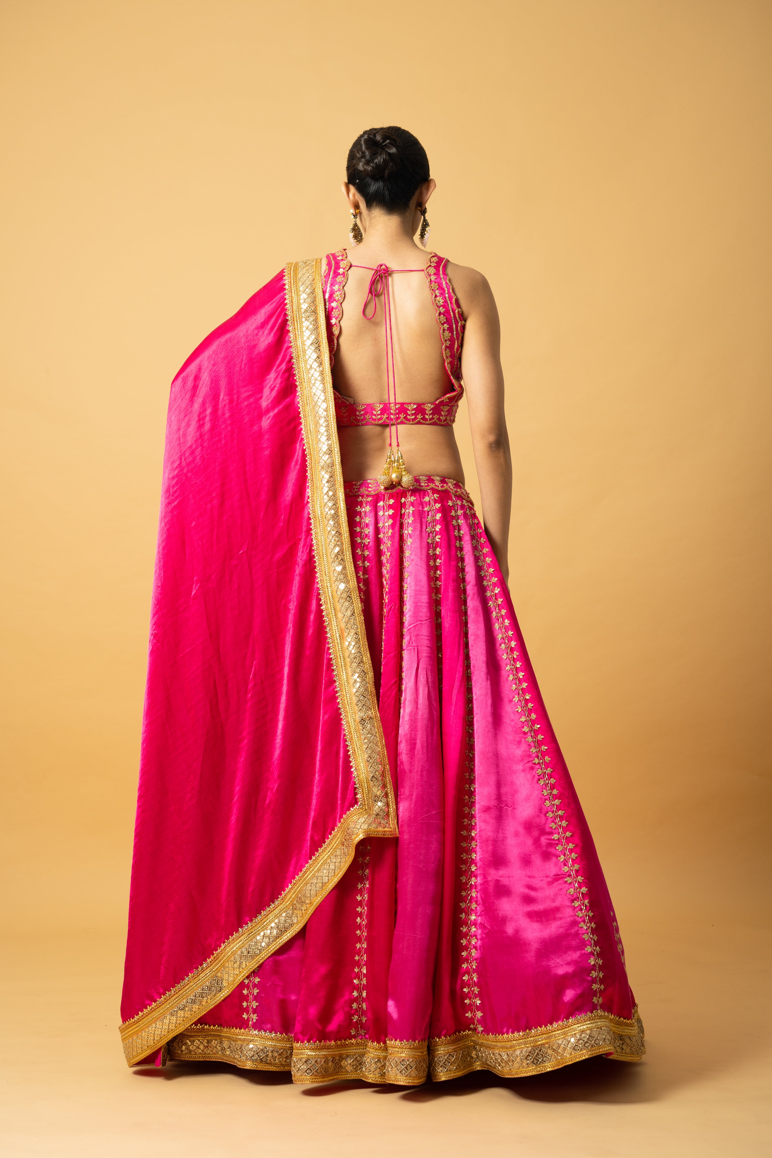 Pink ombré modal satin lehenga with hand embroidery and lace-edged dupatta.