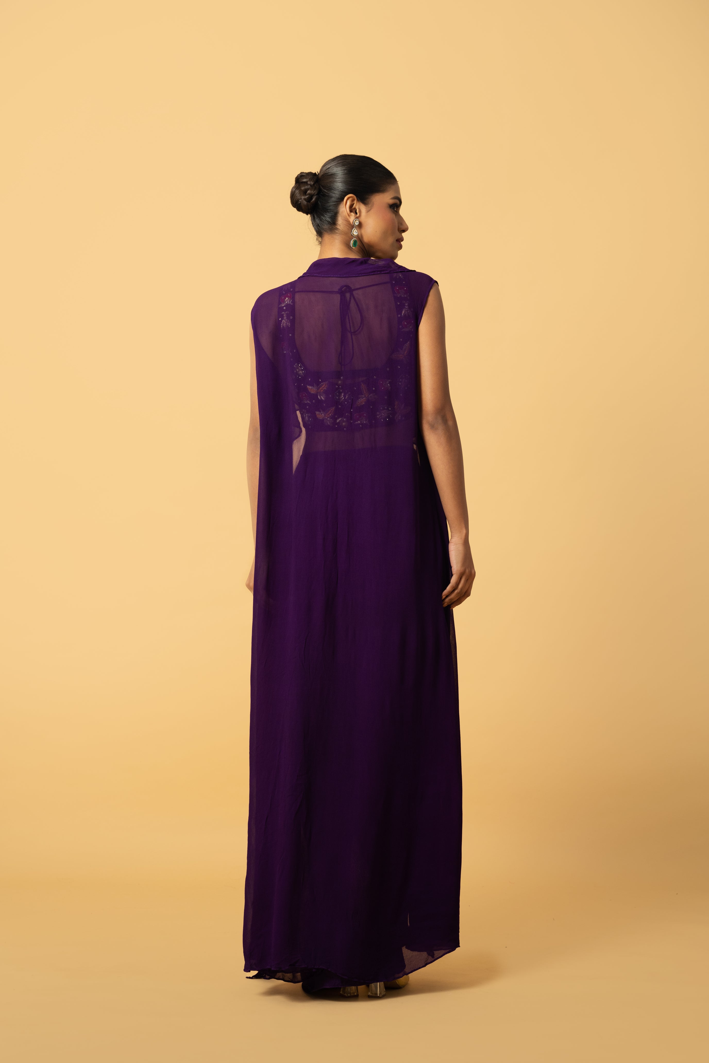 Violet co-ord set with multi-colored hand embroidery and a georgette cape.