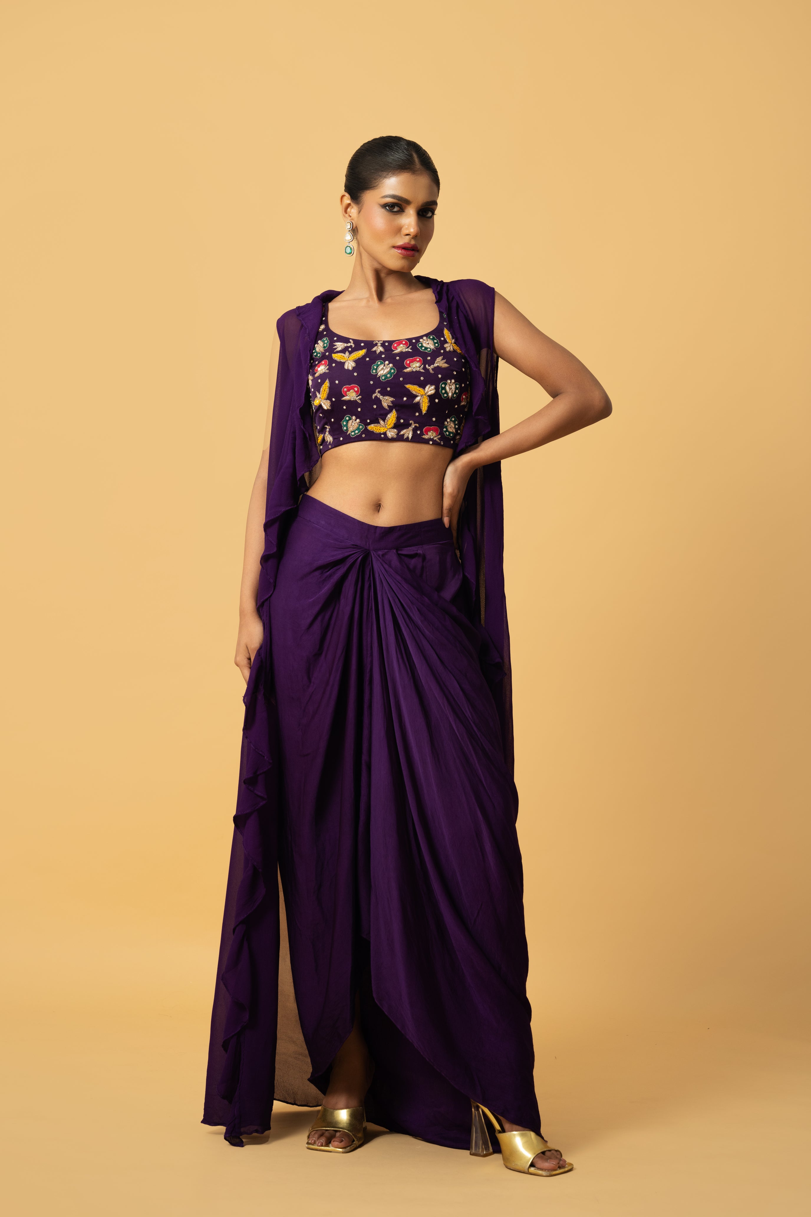 Violet co-ord set with multi-colored hand embroidery and a georgette cape.