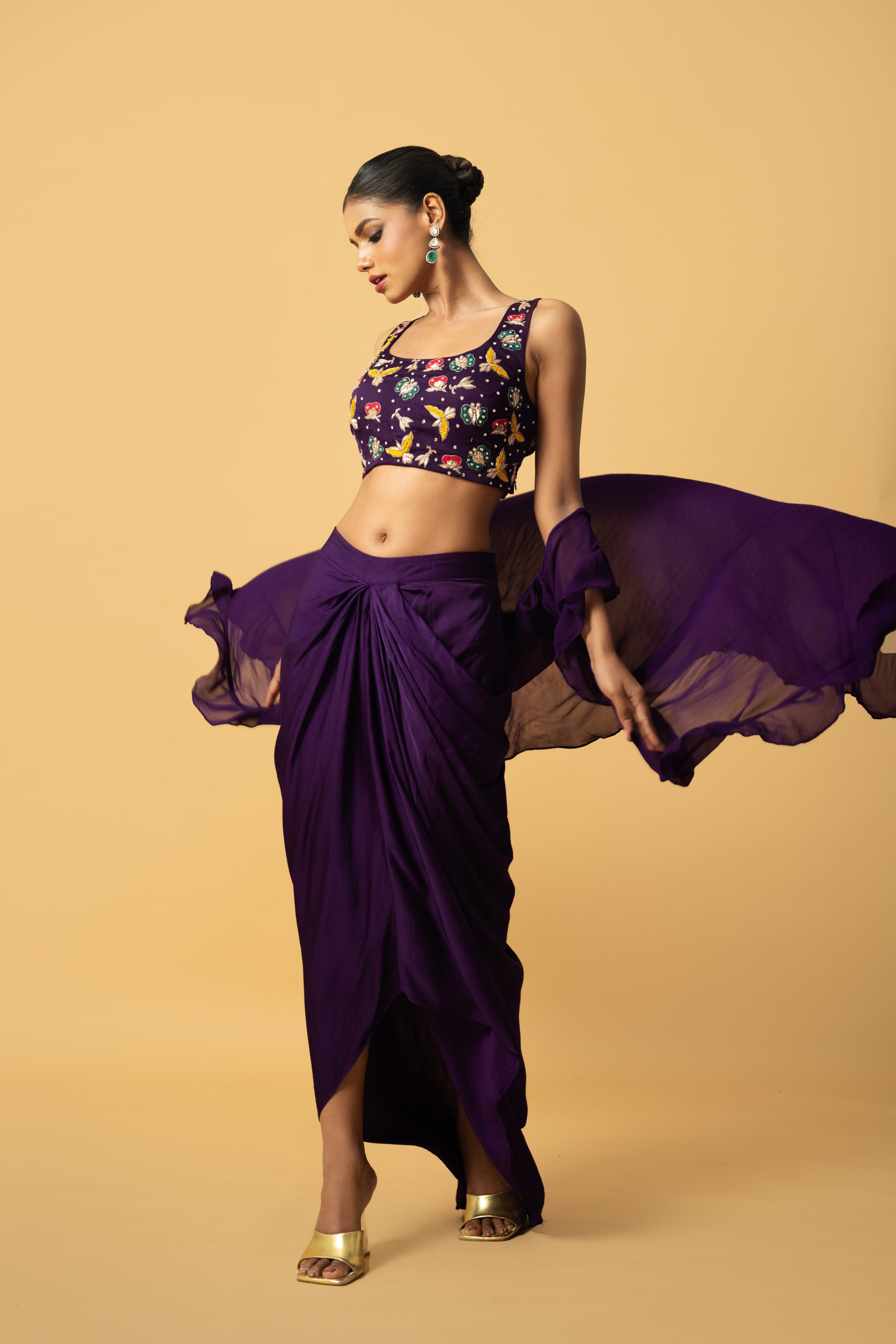 Violet co-ord set with multi-colored hand embroidery and a georgette cape.