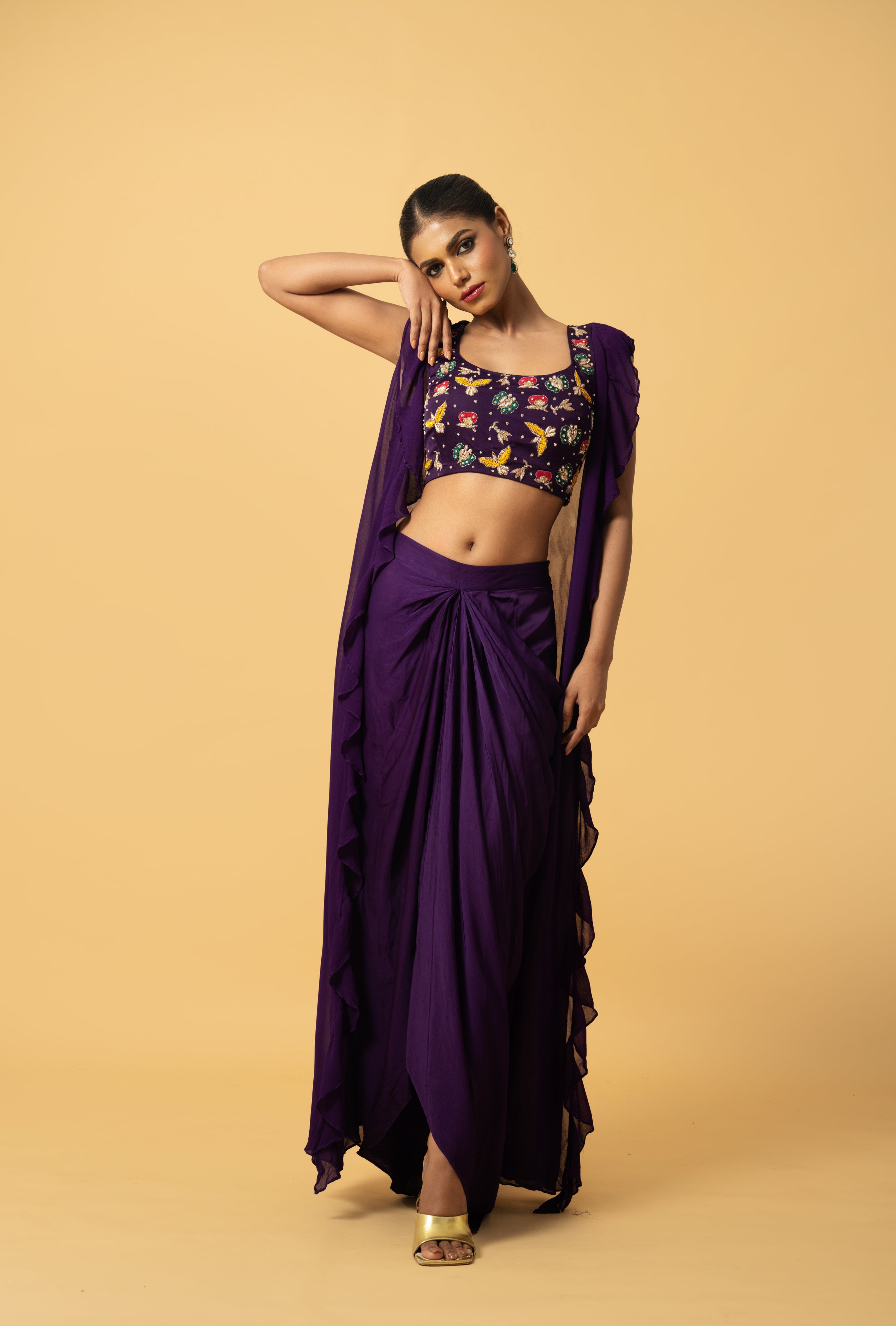 Violet co-ord set with multi-colored hand embroidery and a georgette cape.