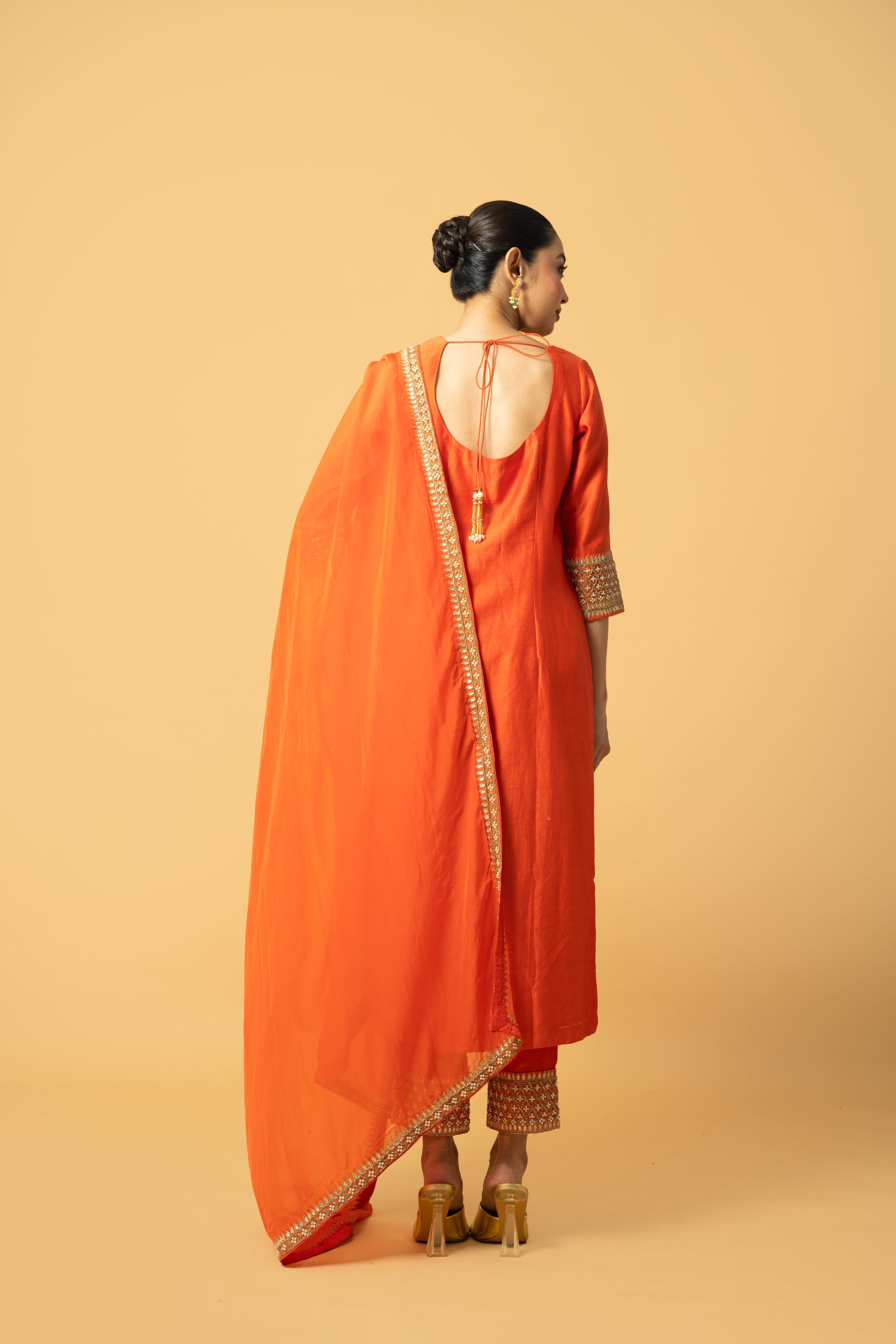 Orange Chanderi silk kurta salwar set with organza dupatta and intricate hand embroidery.