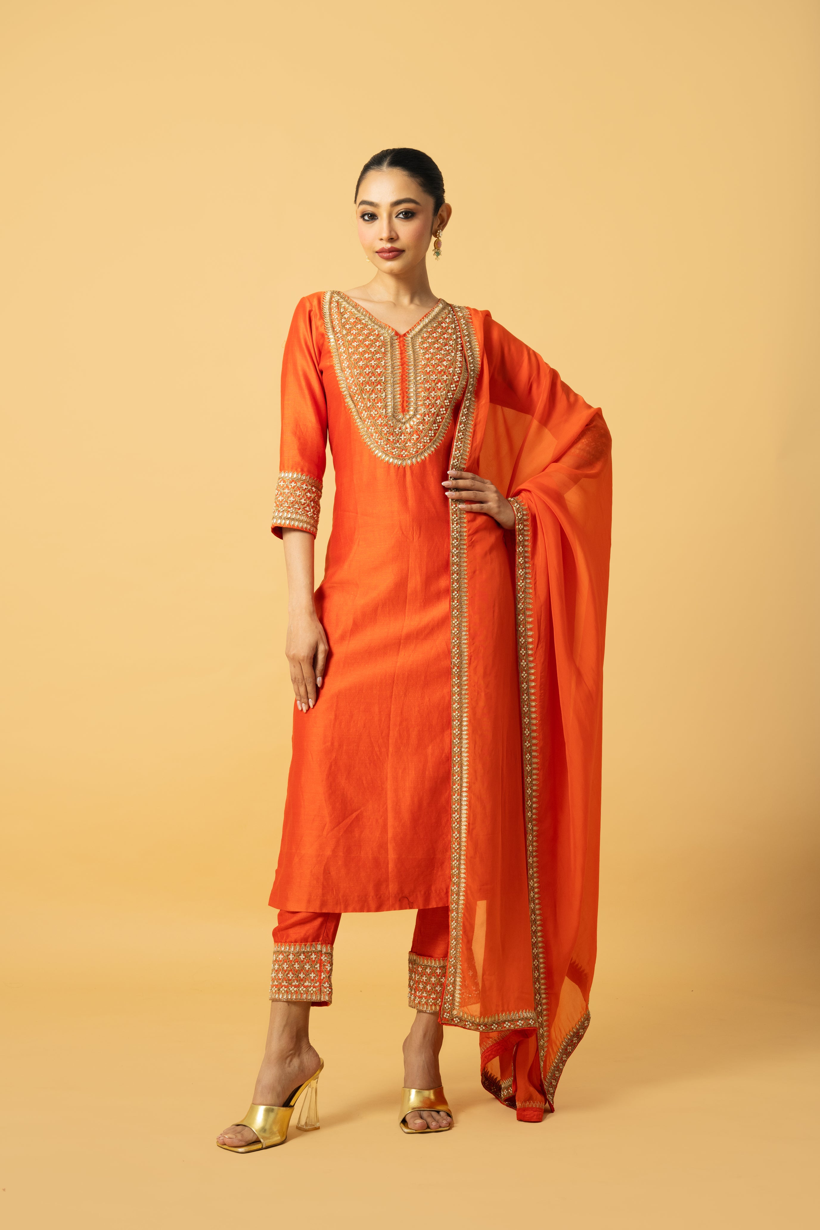 Orange Chanderi silk kurta salwar set with organza dupatta and intricate hand embroidery.