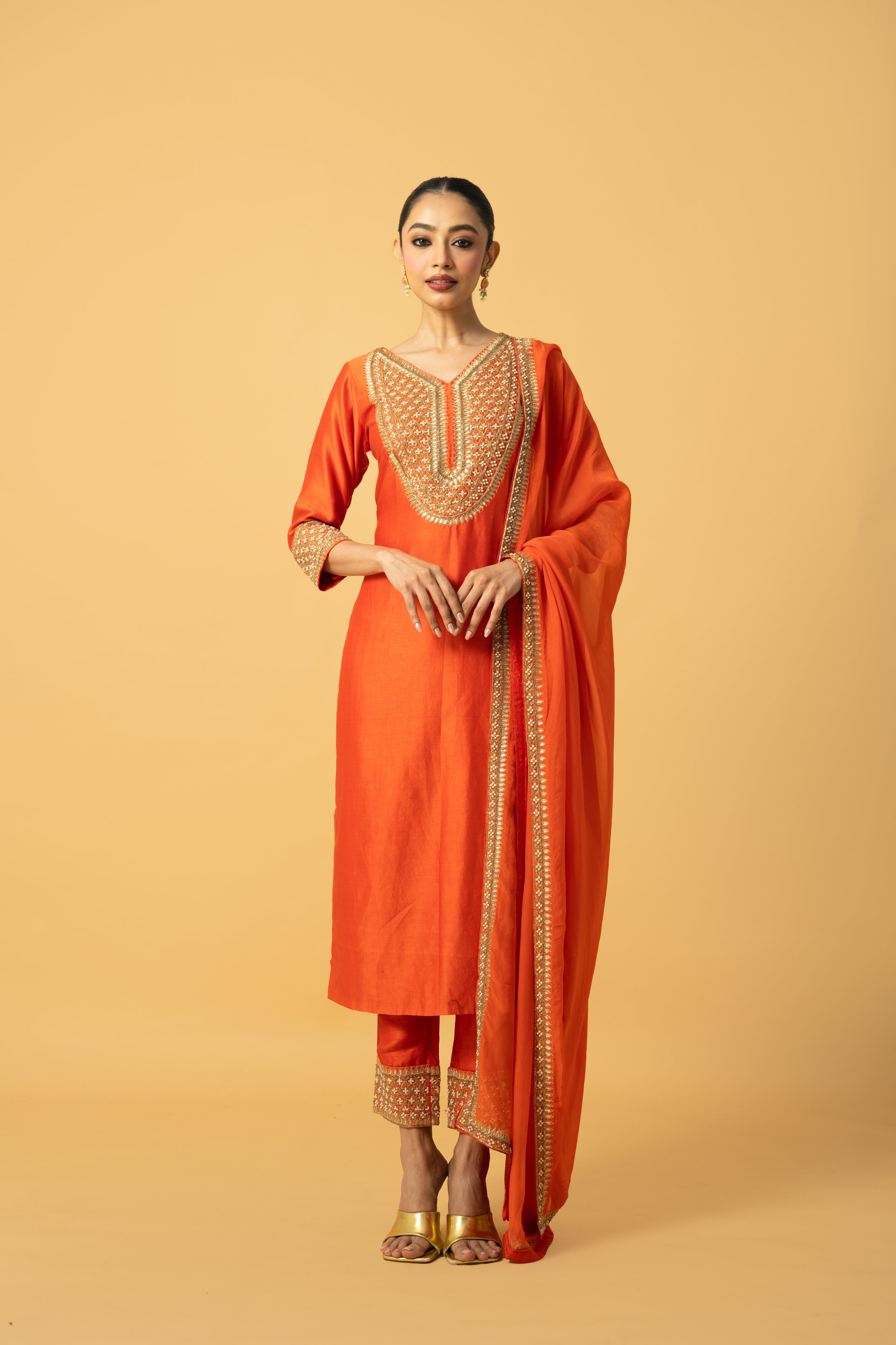 Orange Chanderi silk kurta salwar set with organza dupatta and intricate hand embroidery.