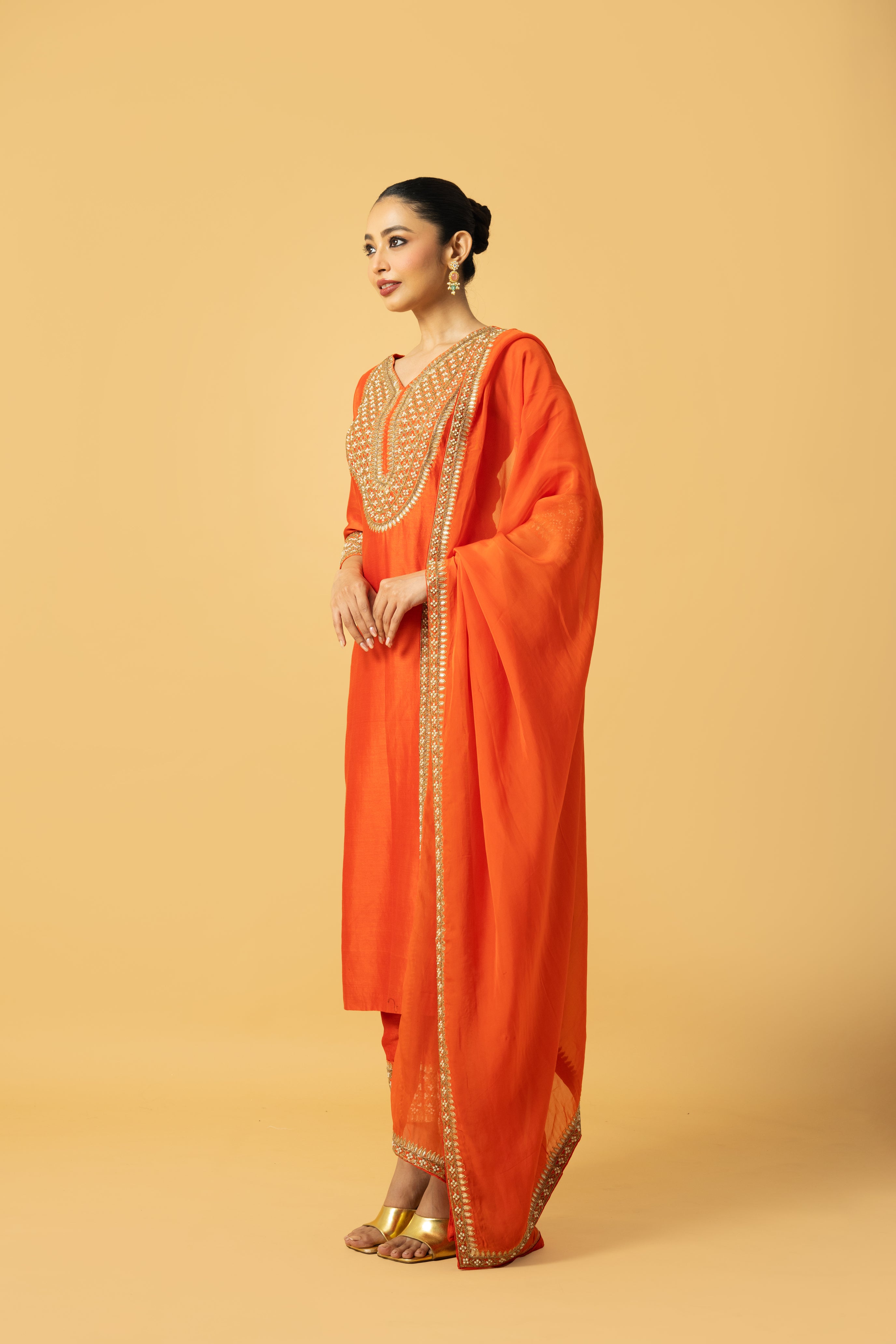Orange Chanderi silk kurta salwar set with organza dupatta and intricate hand embroidery.