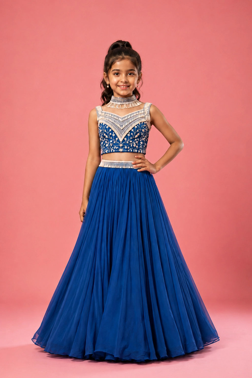 Cobalt blue lehenga crafted in georgette, pearl embroidery on the blouse and belt. Paired with a choker-style soft net dupatta