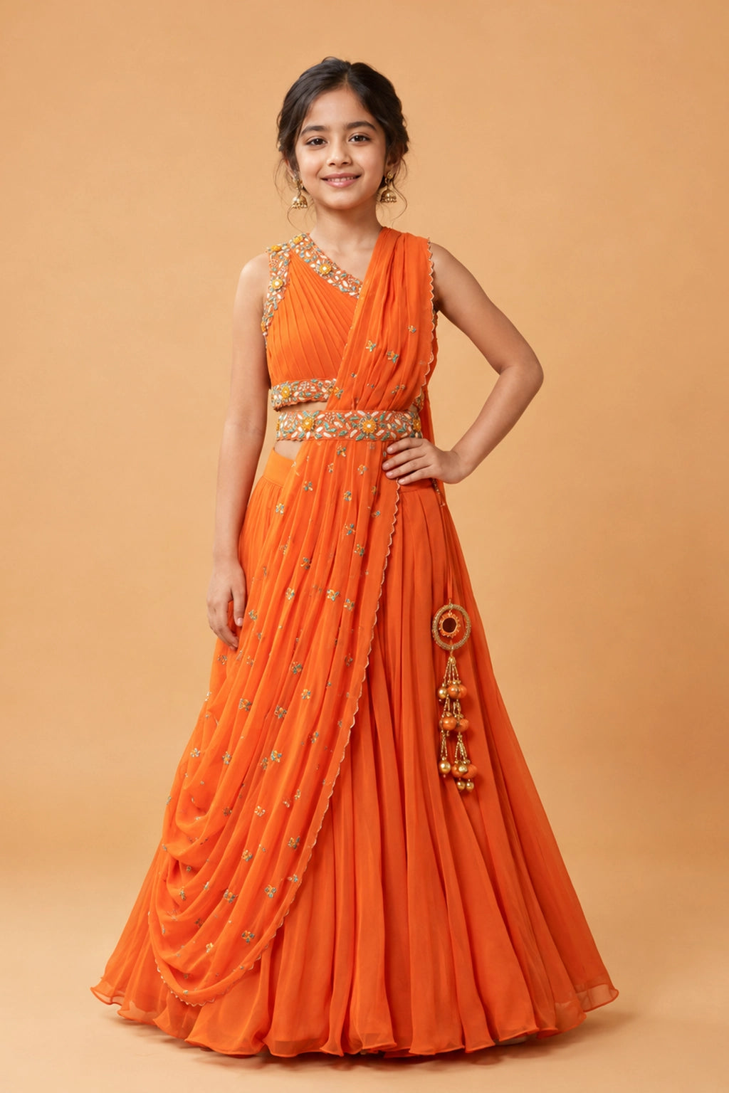 Orange georgette draped lehenga, with hand embroidery. Paired with a matching hand-embroidered belt.
