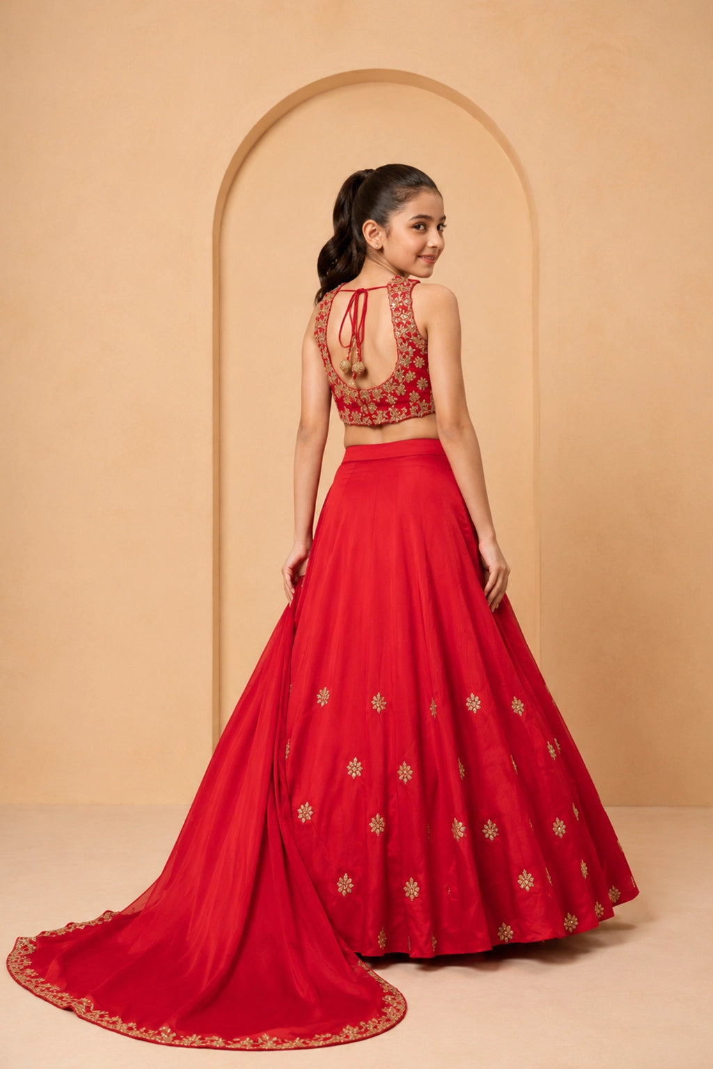 A classic red lehenga crafted in modal silk, adorned with intricate hand embroidery.