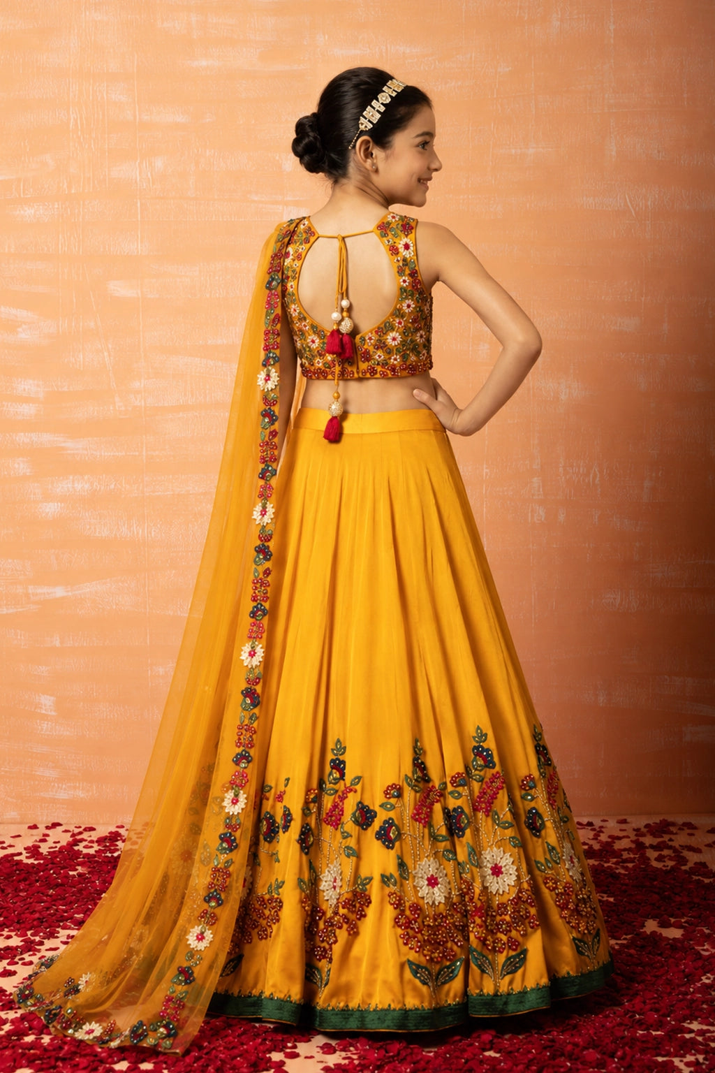 Mustard yellow lehenga crafted from modal silk with intricate 3d applique embroidery. Paired with a matching embroidered dupatta in soft net.