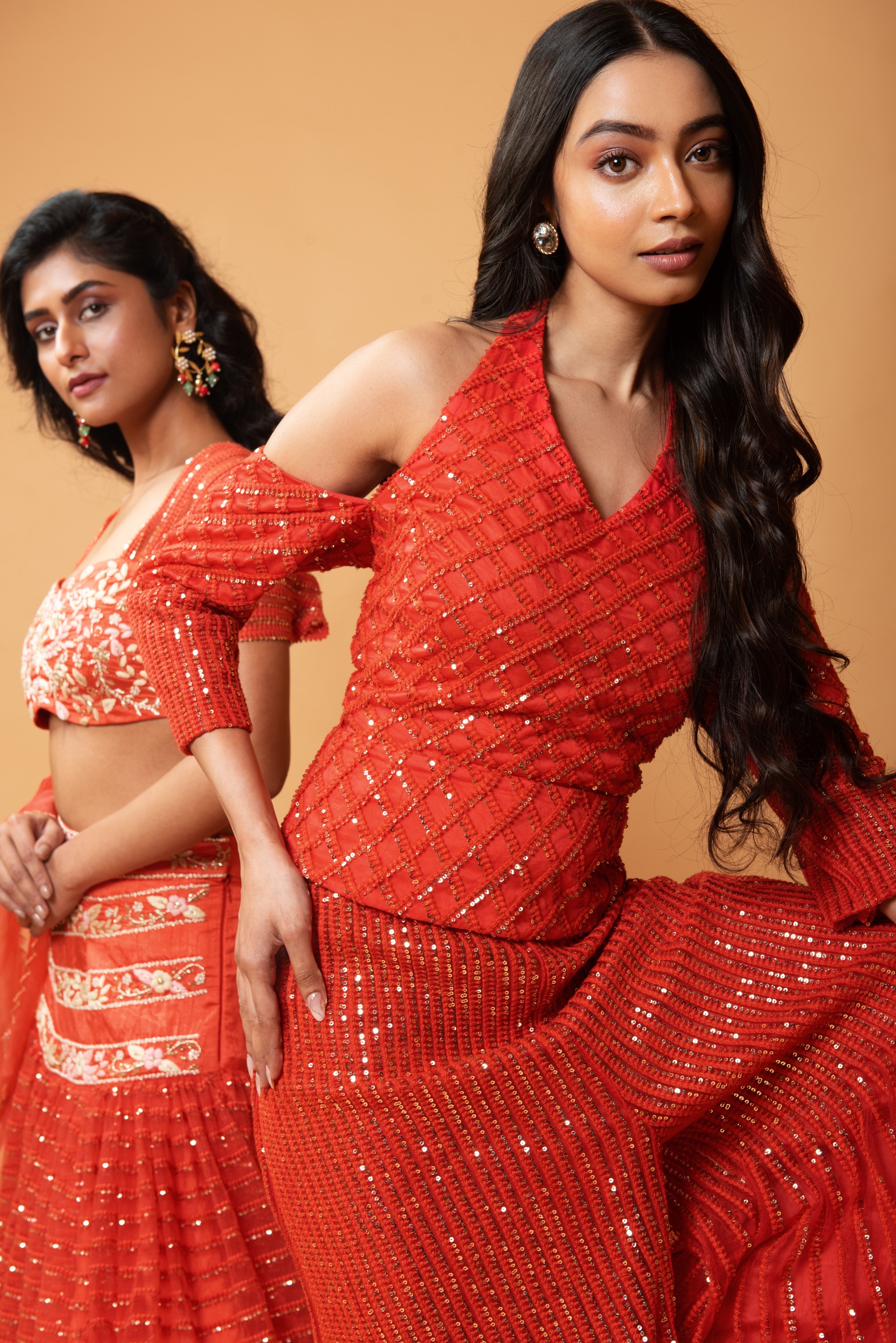 Red sequined tulle sharara set with a halterneck off-shoulder top.