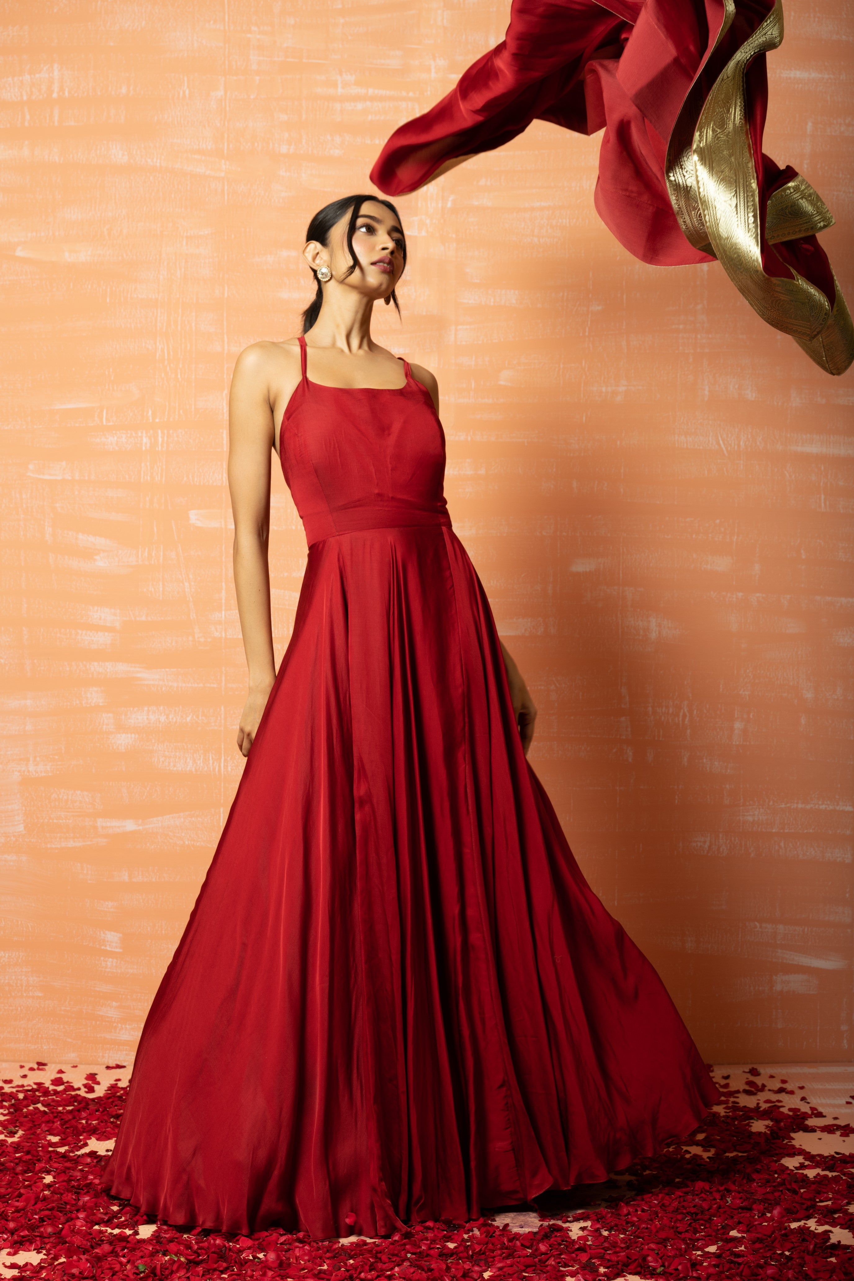 Deep red modal gown with a dupatta accented with zari lace.