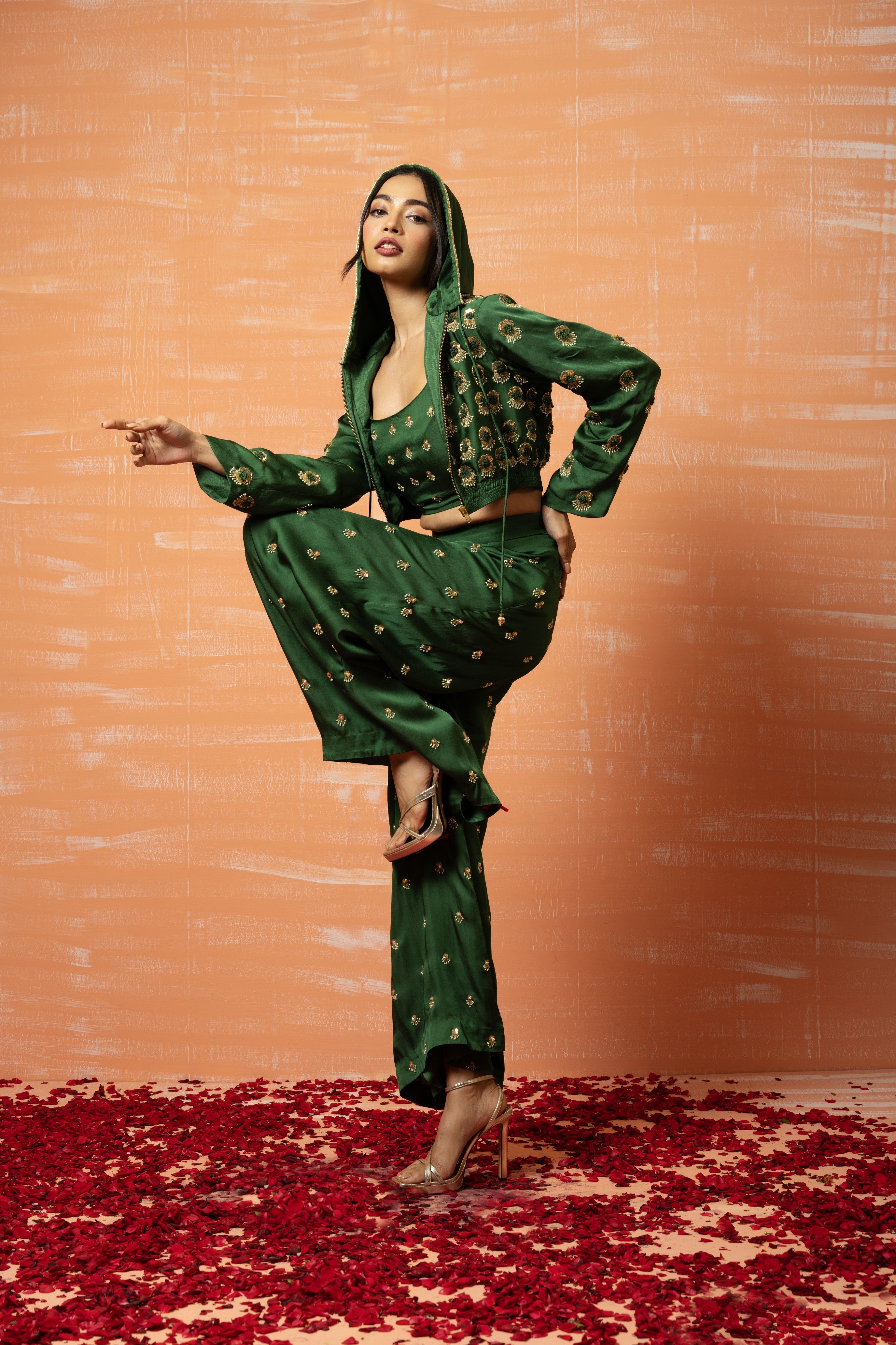 Mehendi green hoodie and palazzo set with hand embroidery.